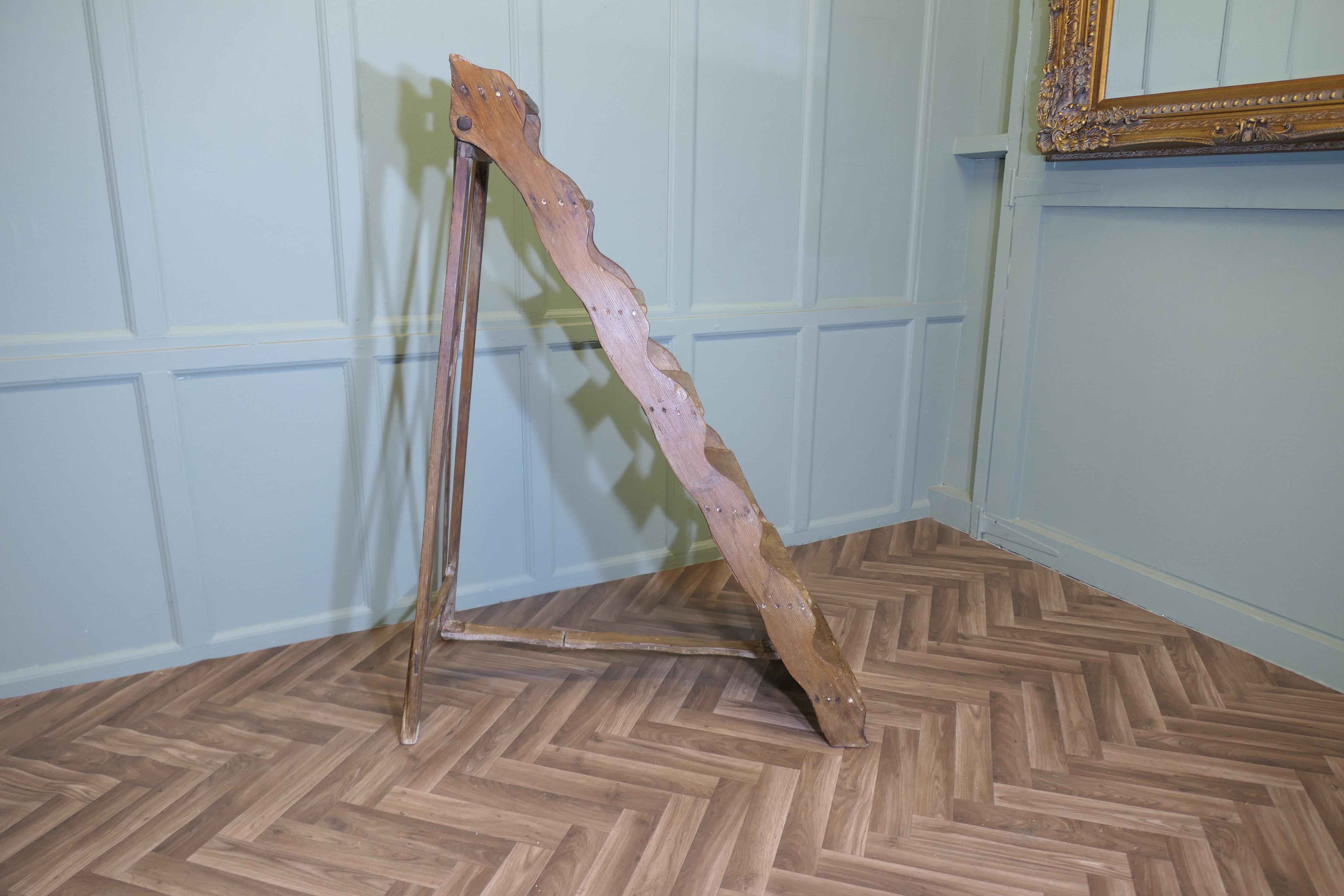 19th Century Pine Step Ladder
This is a very useful and not unattractive piece, the step ladder has 7 treads, it has a very attractive waved edge 
The ladder would work well in a kitchen, shop, library or anywhere where a little extra height would