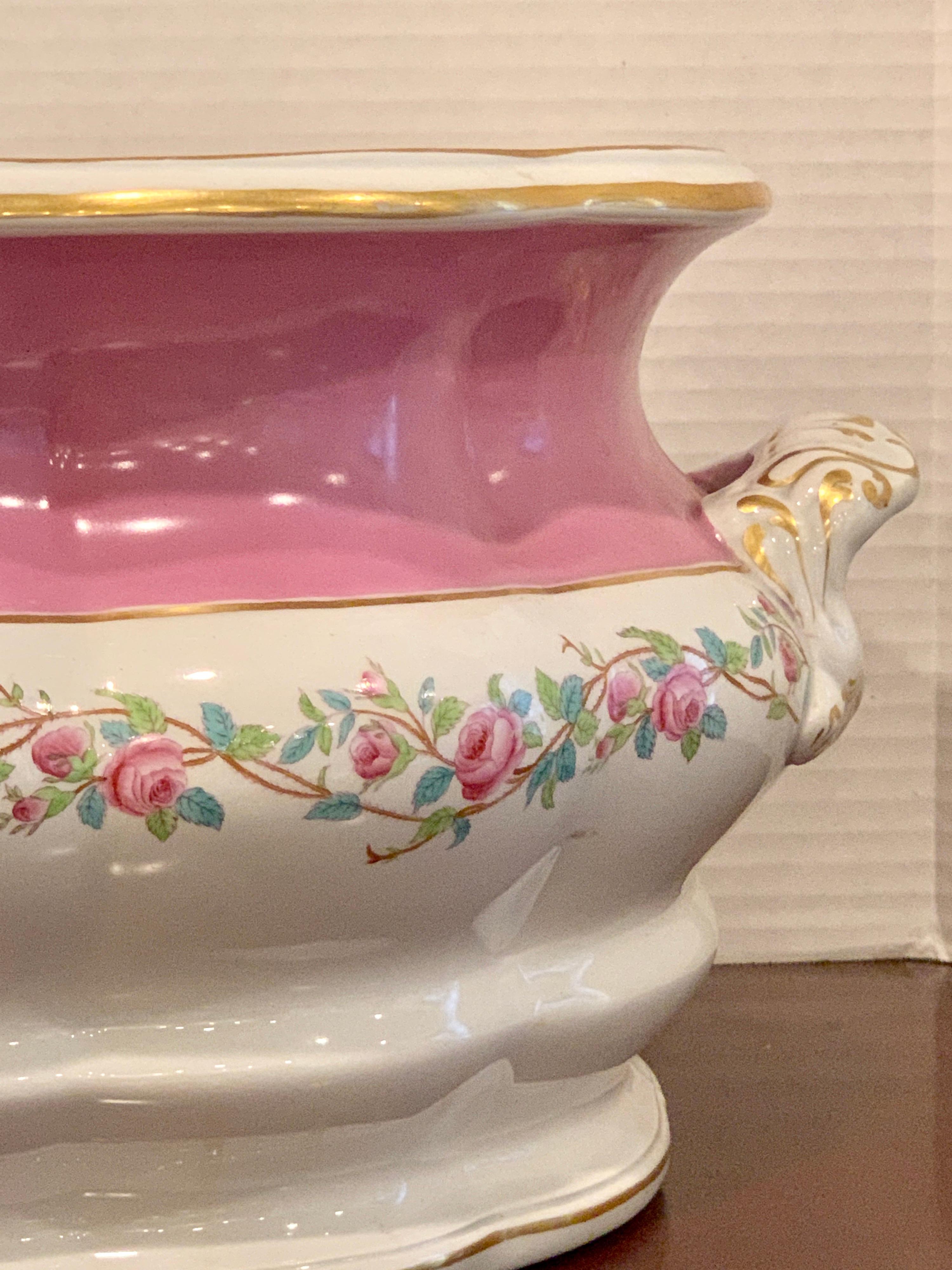 19th century pink floral porcelain foot bath, attributed to Mintons.
With oval pink palette handled body, base measues 14.5