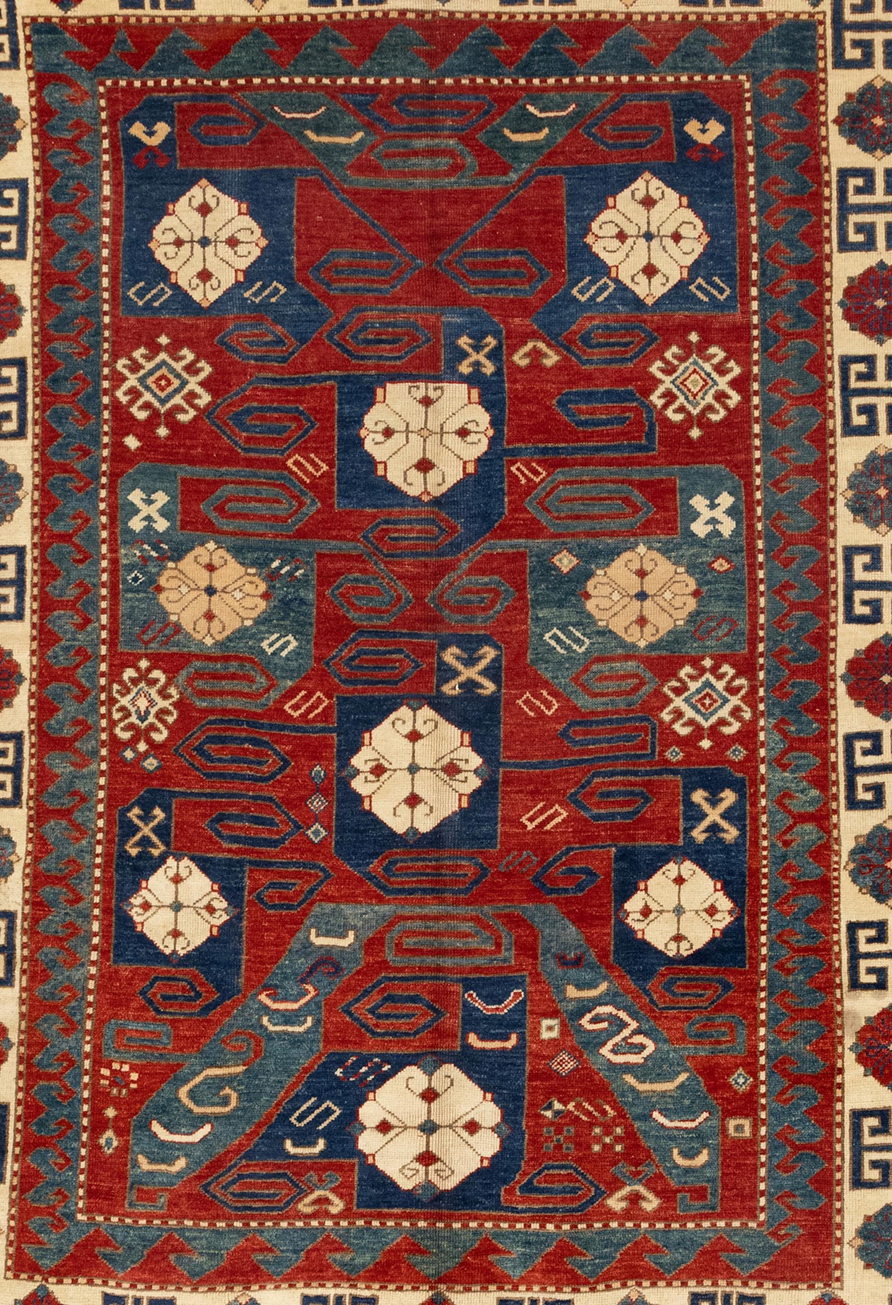 Central Asian 19th Century Pinwheel Kazak Inspired Rug For Sale