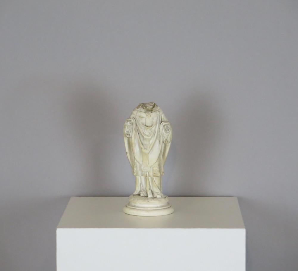 Headless Plaster Statue of a Saint or Bishop. France, circa early 19th century. 