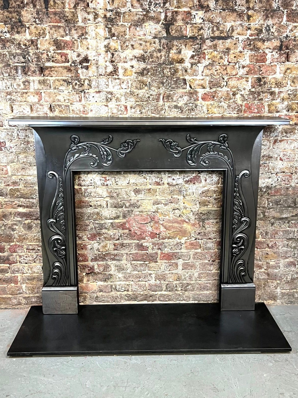 19th century cast iron polished fireplace mantlepiece.
This English Made Art Nouveau Fireplace, dated circa 1890 - 1910 is typically characterized by its detailed long sinuous organic lines - inspired by sophisticated flowing plant forms. This fine