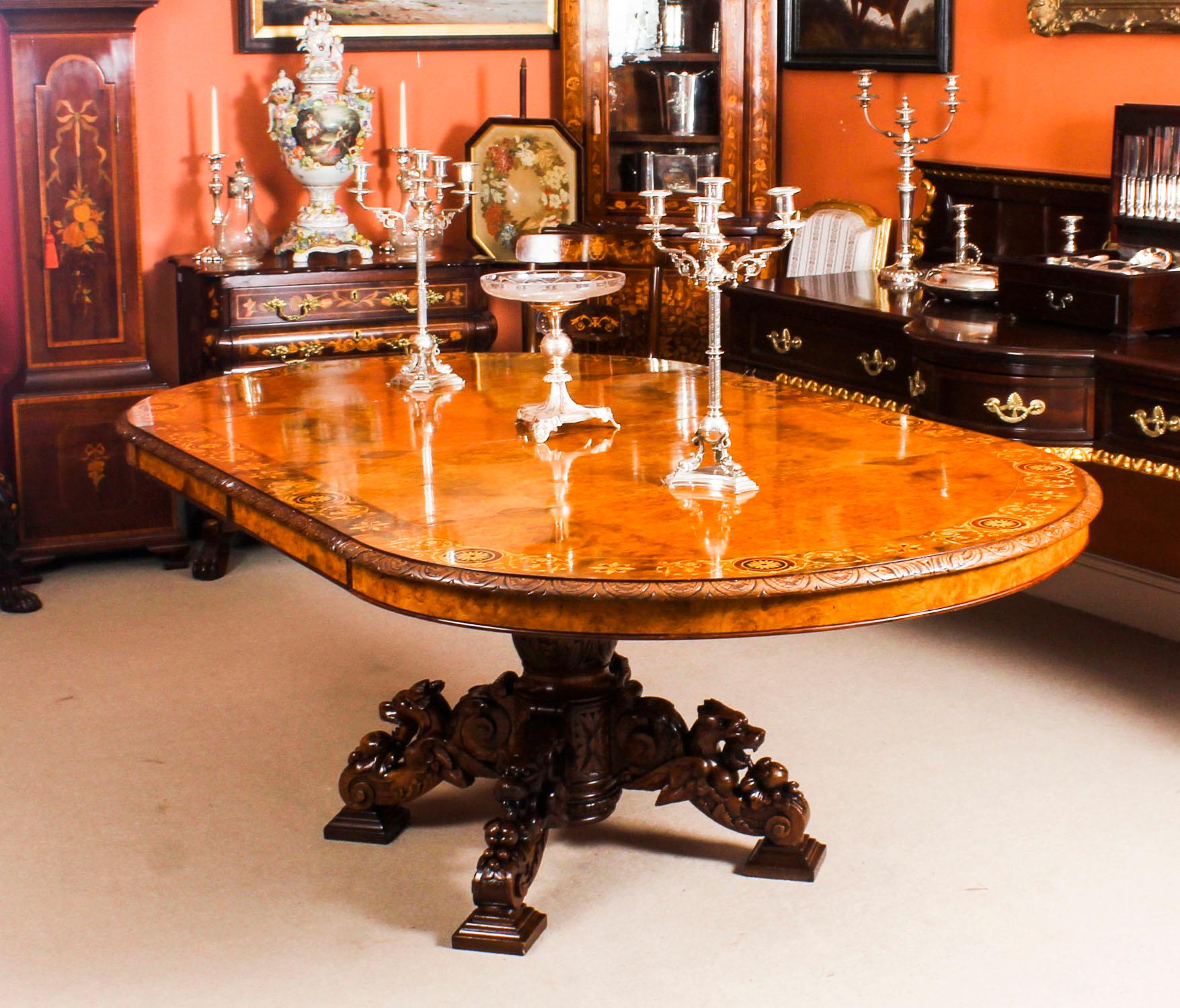 There is no mistaking the style and design of this exquisite Victorian pollard oak and marquetry extending dining table, circa 1880 in date. 

This stunning table has two leaves which can be added or removed as required to suit the occasion and
