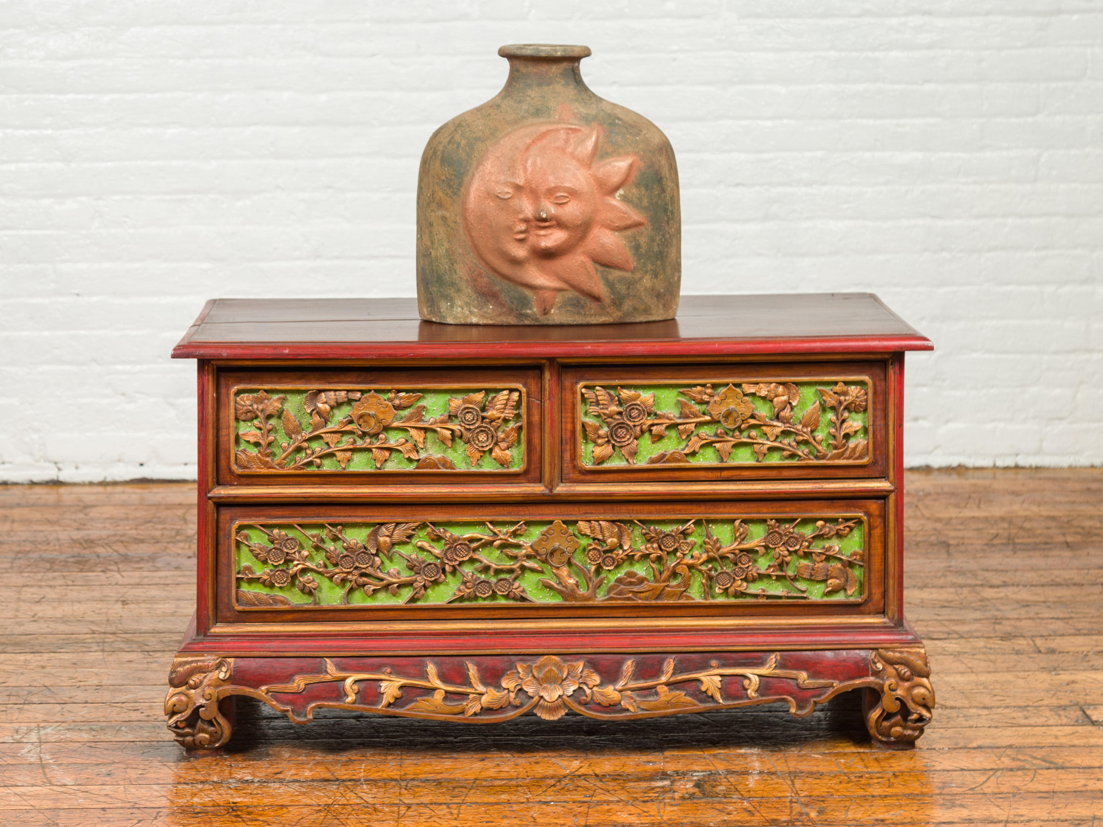 An Indonesian polychrome dresser from Madura with carved drawers and verdigris highlights. We have another dresser available that is very similar and will make for a perfect pair. See item LU863919142832. Immerse yourself in the captivating artistry