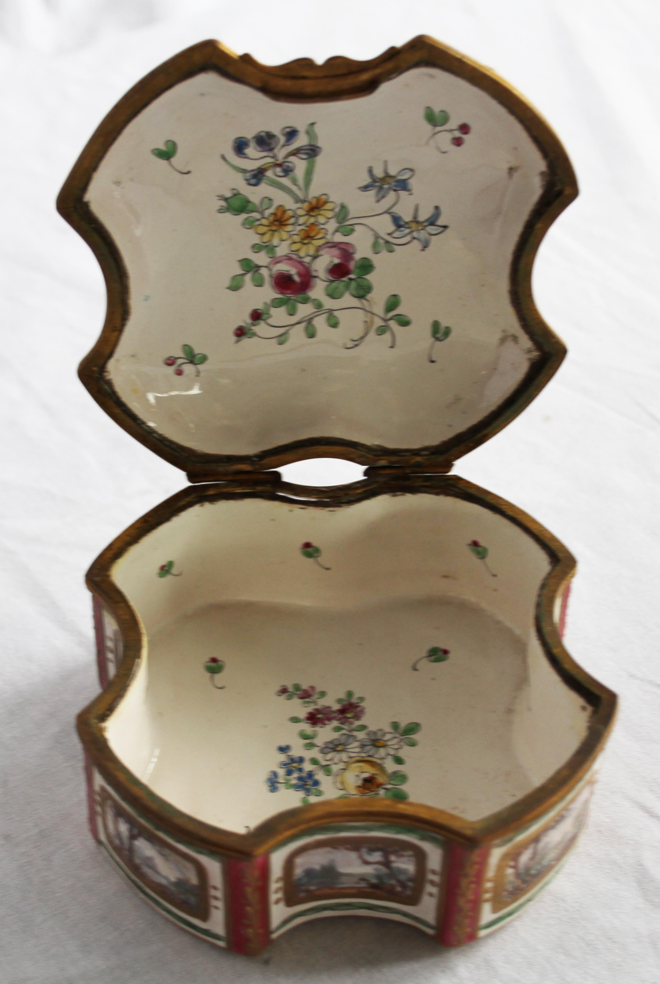 A French porcelain box. In 18th century style but 19th century. Of shaped square design inscribed. Le Coq el le Perle. Decorated throughout with Cockerels in a rustic scene. With detachable cover. Marked Sceaux to base.