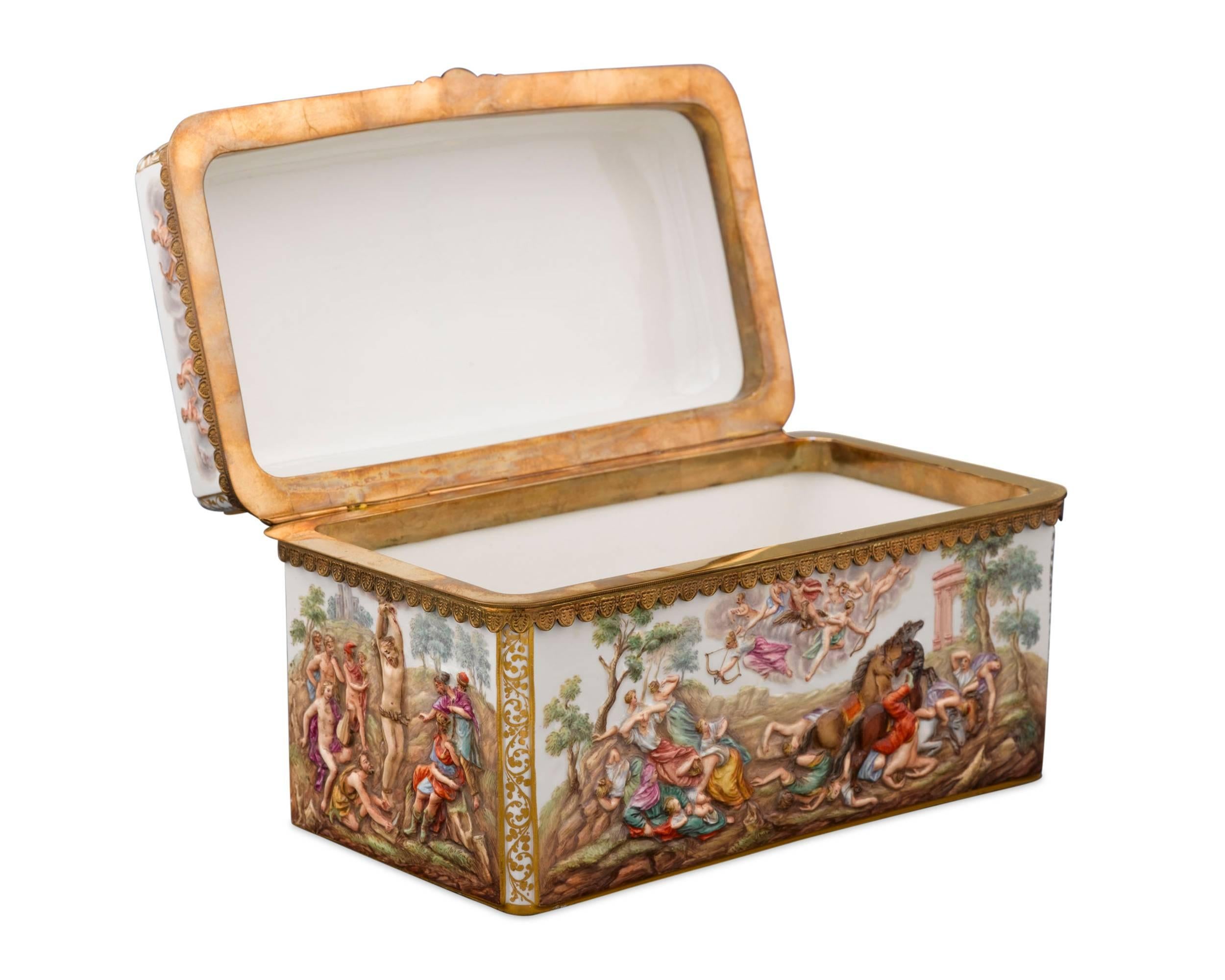 Incredible hand-painted bas-relief scenes cover this magnificent Meissen Porcelain casket. Displaying a furious battle, bathers and torture, all witnessed, and possibly influenced, by hovering gods, this casket is a celebration of classical design