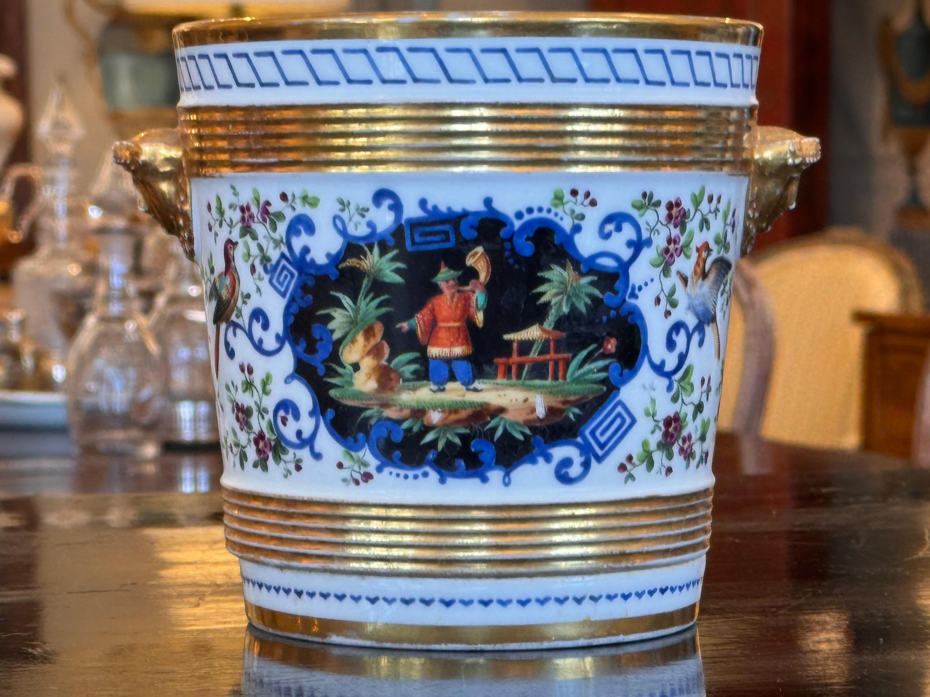 A chinoiserie decorated cachpot. It has original saucer. Made in 19th Century.