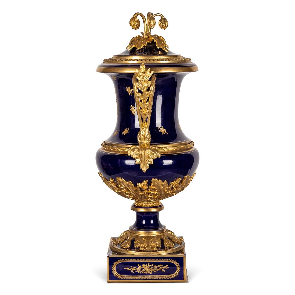 Antique mid-19th Century French fine Serves vase, exquisitely covered in rich cobalt blue glaze over porcelain ground. The base applied with large cast ormolu acanthus leaves, elabarate scroll side handles and decorative finial cast as snowdrop