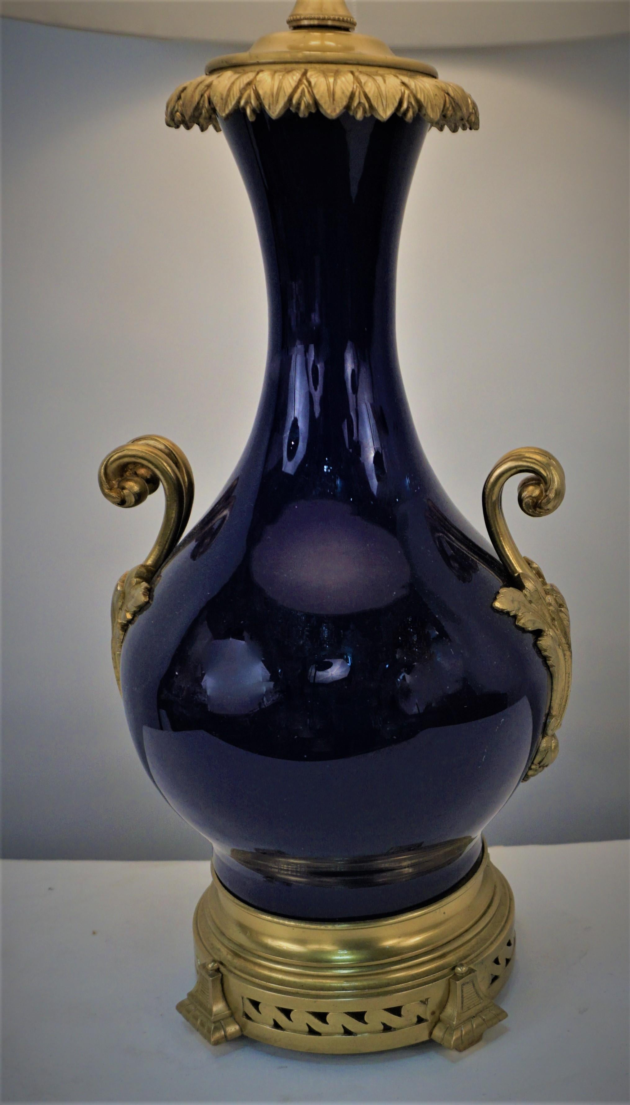 19th century cobalt blue porcelain with bronze mounting oil lamp that has been professionally electrified and fitted with silk lampshade.