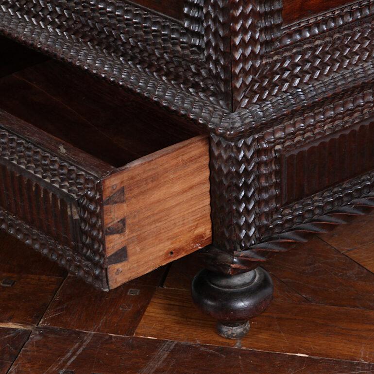19th Century Portuguese chest or coffer with unique pierce-carved interior and two lower drawers, accented with ripple molding throughout.


