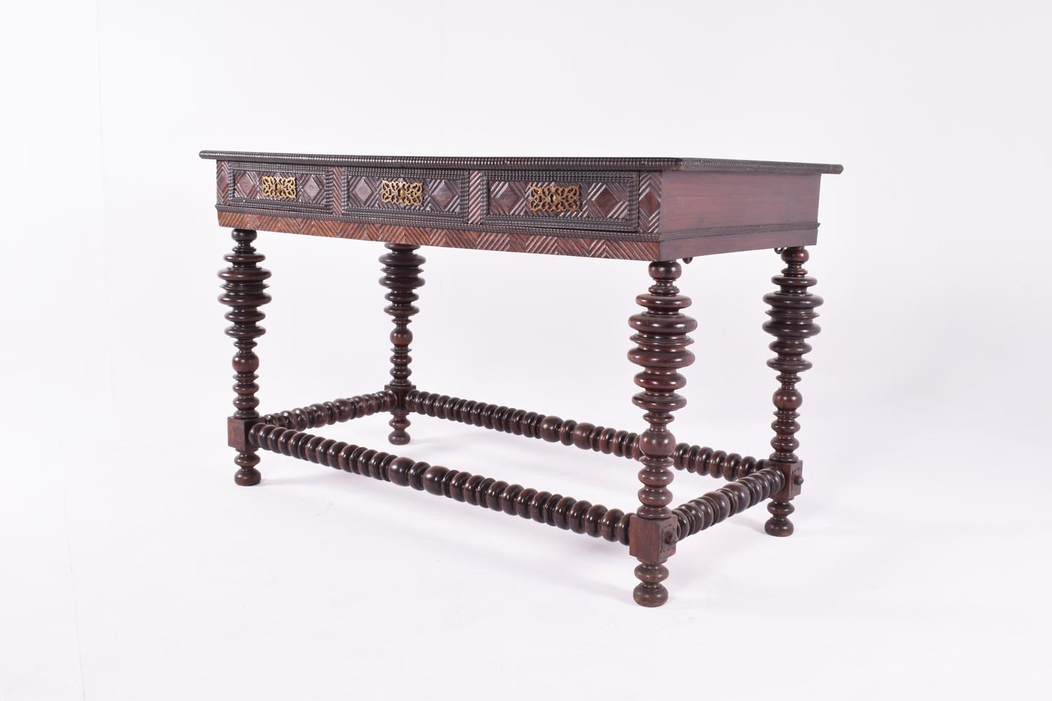 Early 19th century Portuguese buffet center table, in rosewood with barley twist legs and stretcher base, three drawers with metallic gold handles. Beautiful woodwork, making it an unique and rare piece nowadays.