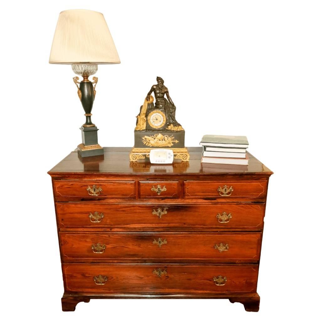 Simple yet elegant commode dressing chest of six drawers made from imported Amazon rosewood. The generous plank top sits above a row of three small drawers and another three rows of chest-wide drawers which are adorned with an elegant inlay of