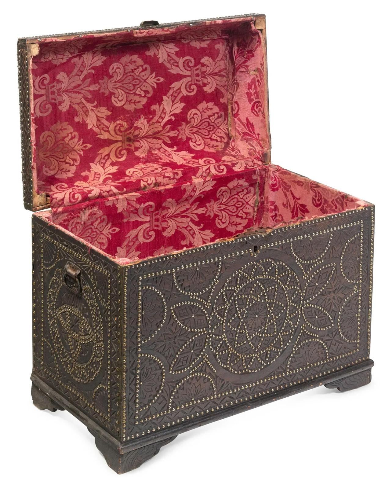 A Portuguese studded chest made from walnut, circa 1860.

Dimensions: 26.5