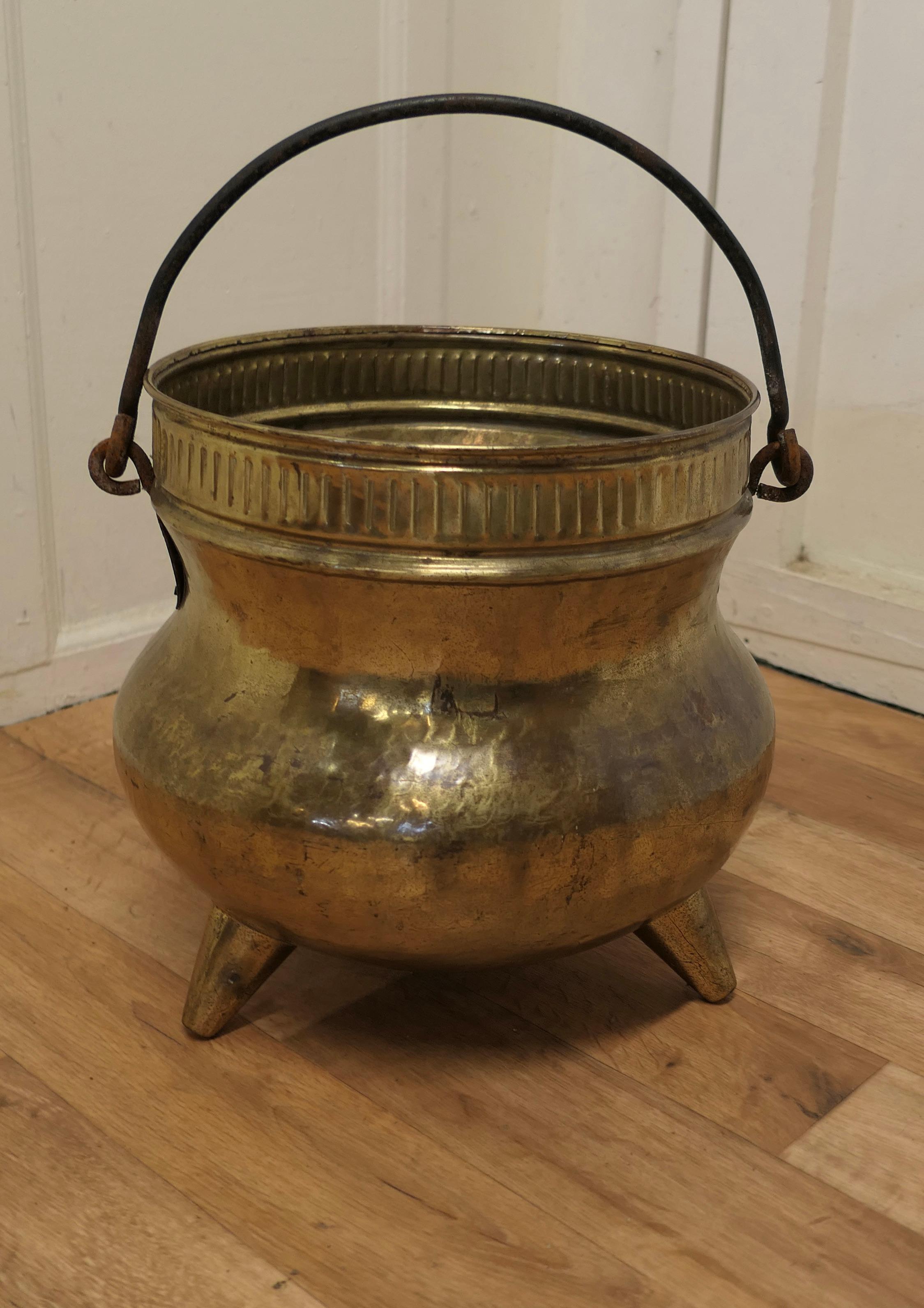 19th century pot belly, brass coal bucket on feet

This is a lovely big beaten copper coal or log bucket, it has a good rounded piece and would make a really good coal or log container and handy because it has a riveted iron carrying handle and it