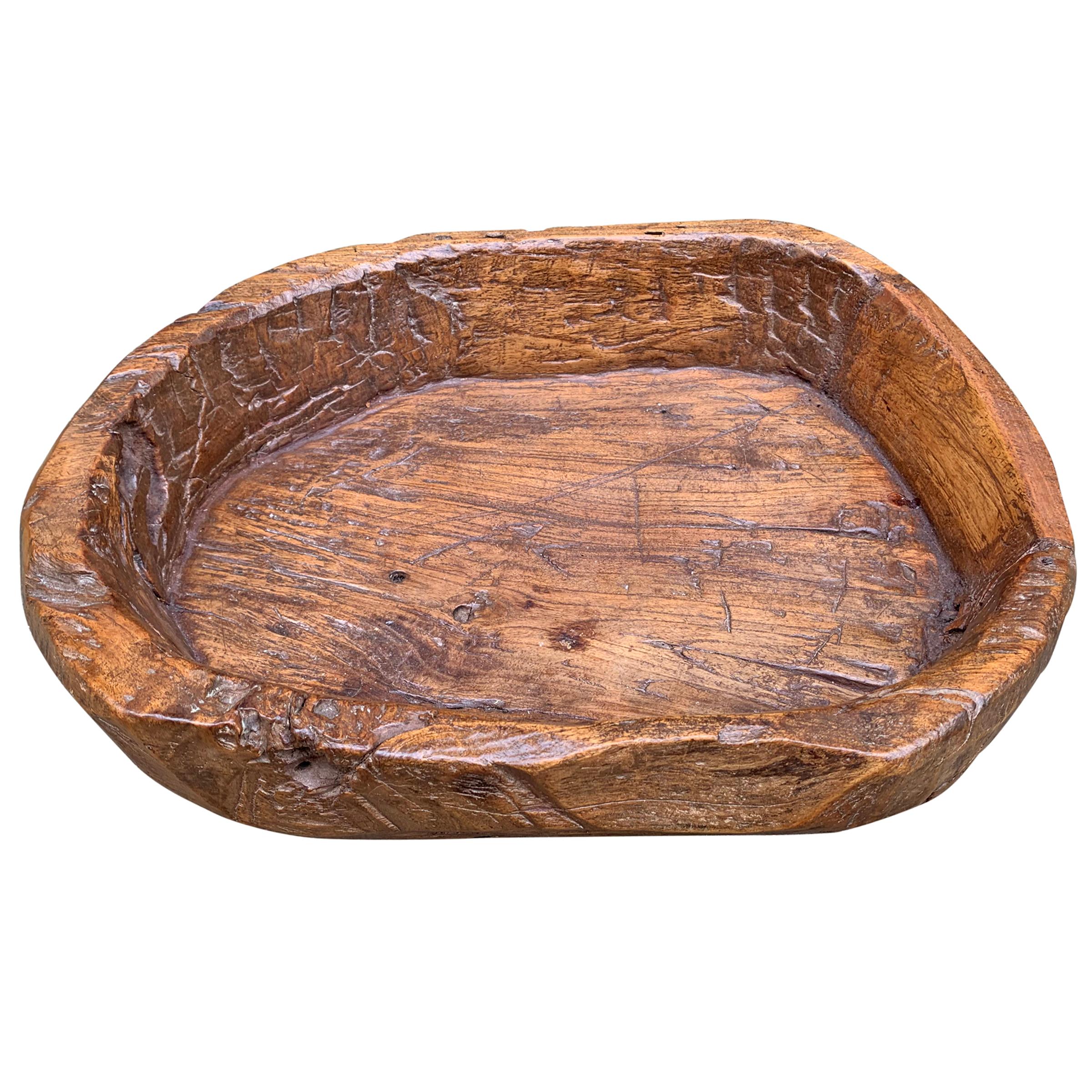 A fantastic 19th century primitive wood bowl with signs of hand carving, a wide flat bottom, and a fantastic patina. Would be perfect for catching the day’s mail, serving bread at your next dinner party, or filled with hand towels in your powder
