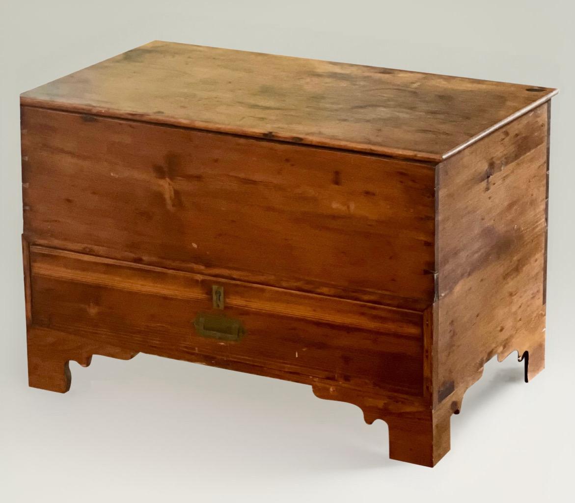Primitive fir and pine small blanket or hope chest with drawer, late 19th century.

This charming chest has handcrafted dovetail construction and features a drawer with original paper lining and brass hardware beneath an interior cabin (7.75
