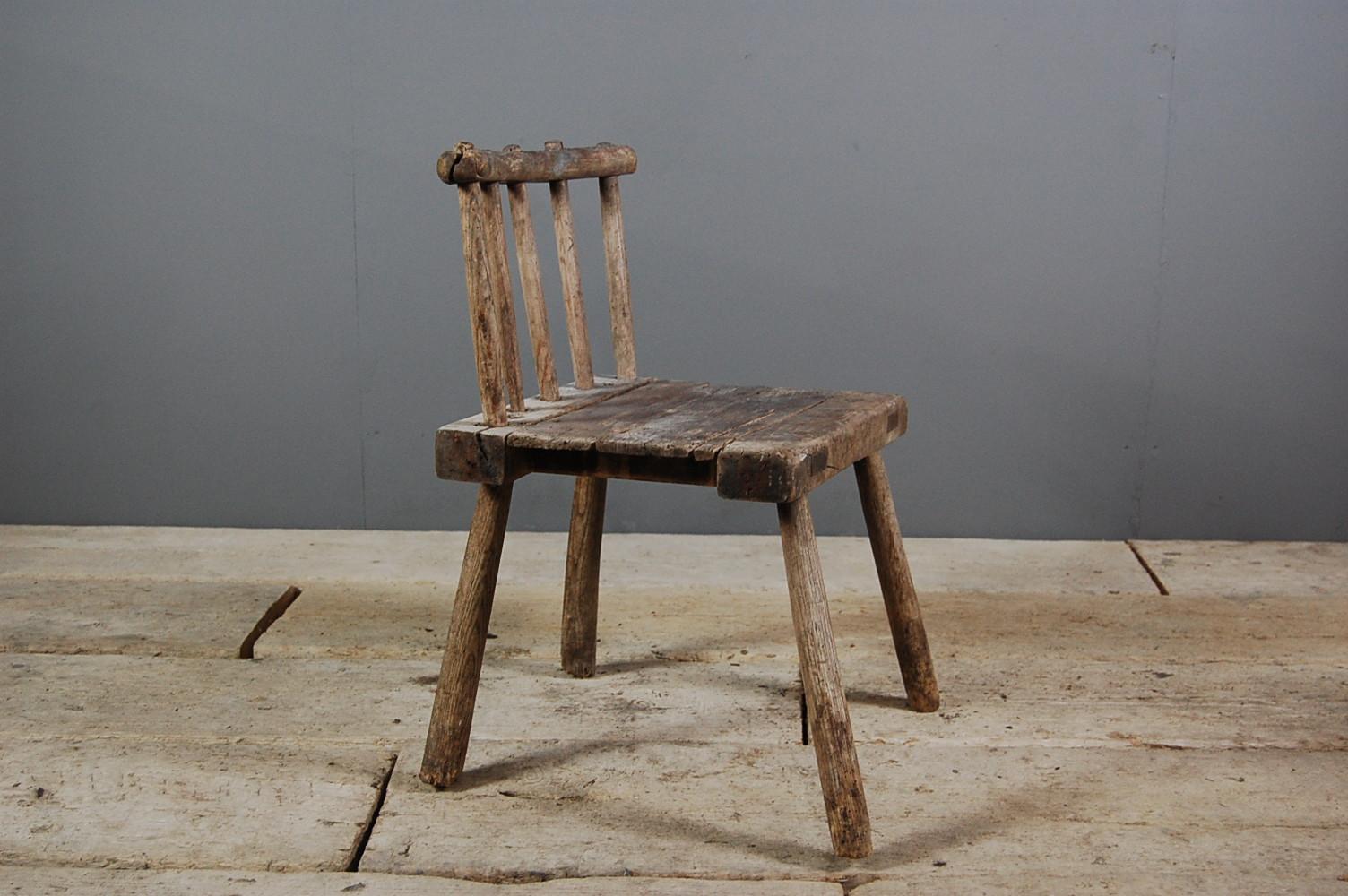 Primitive 19th century Hedge chair, wonderful dry surface, with lots of wear and patination, signs of historical worm and some minor losses. Although small these are in fact Ireland, circa 1850. Measures: Seat height 38cm.