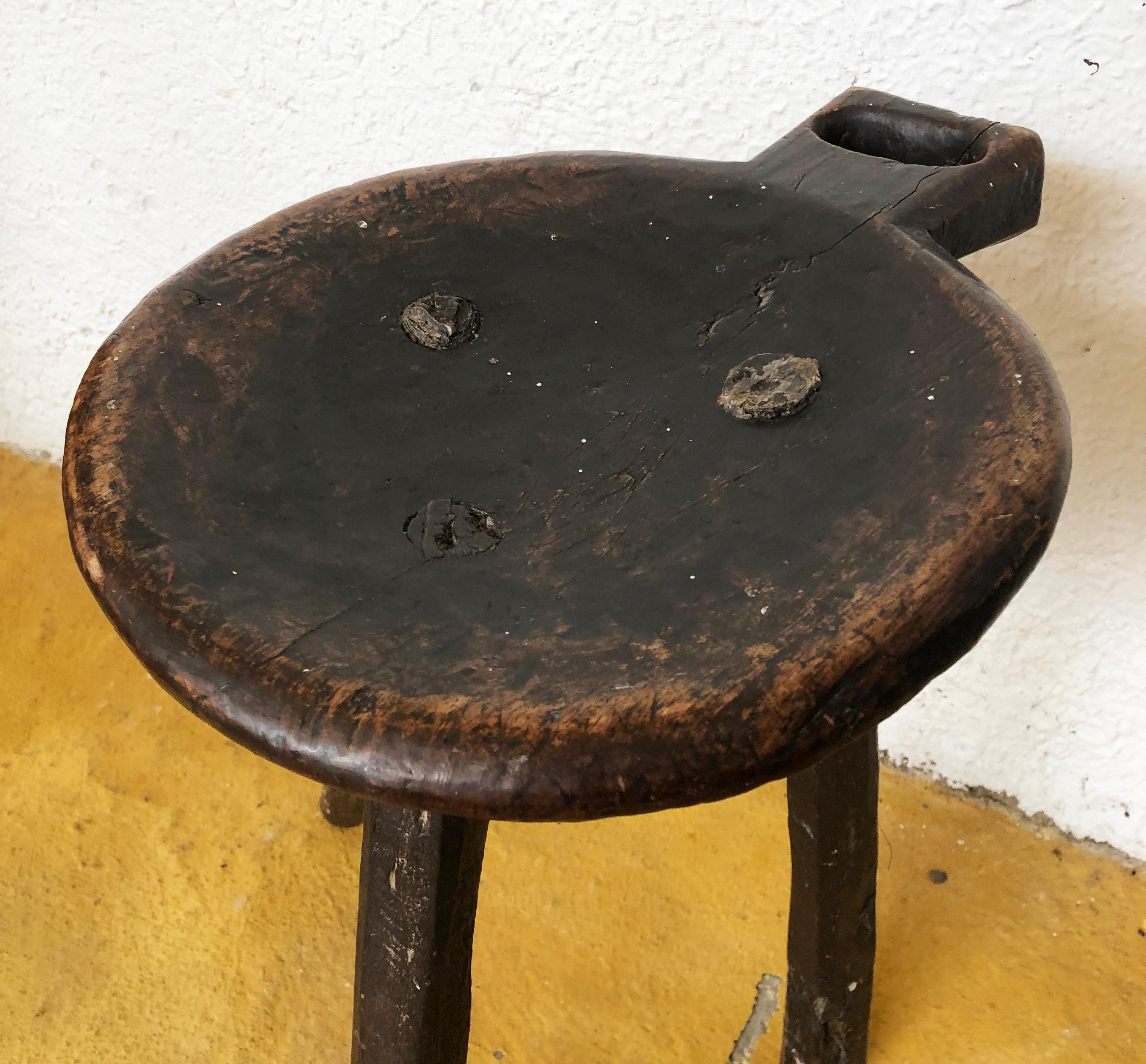 Three legged with a round seat late 19th century primitive Mexican milking stool. 
Distressed and weathered finish. 
Found in Western México.


  