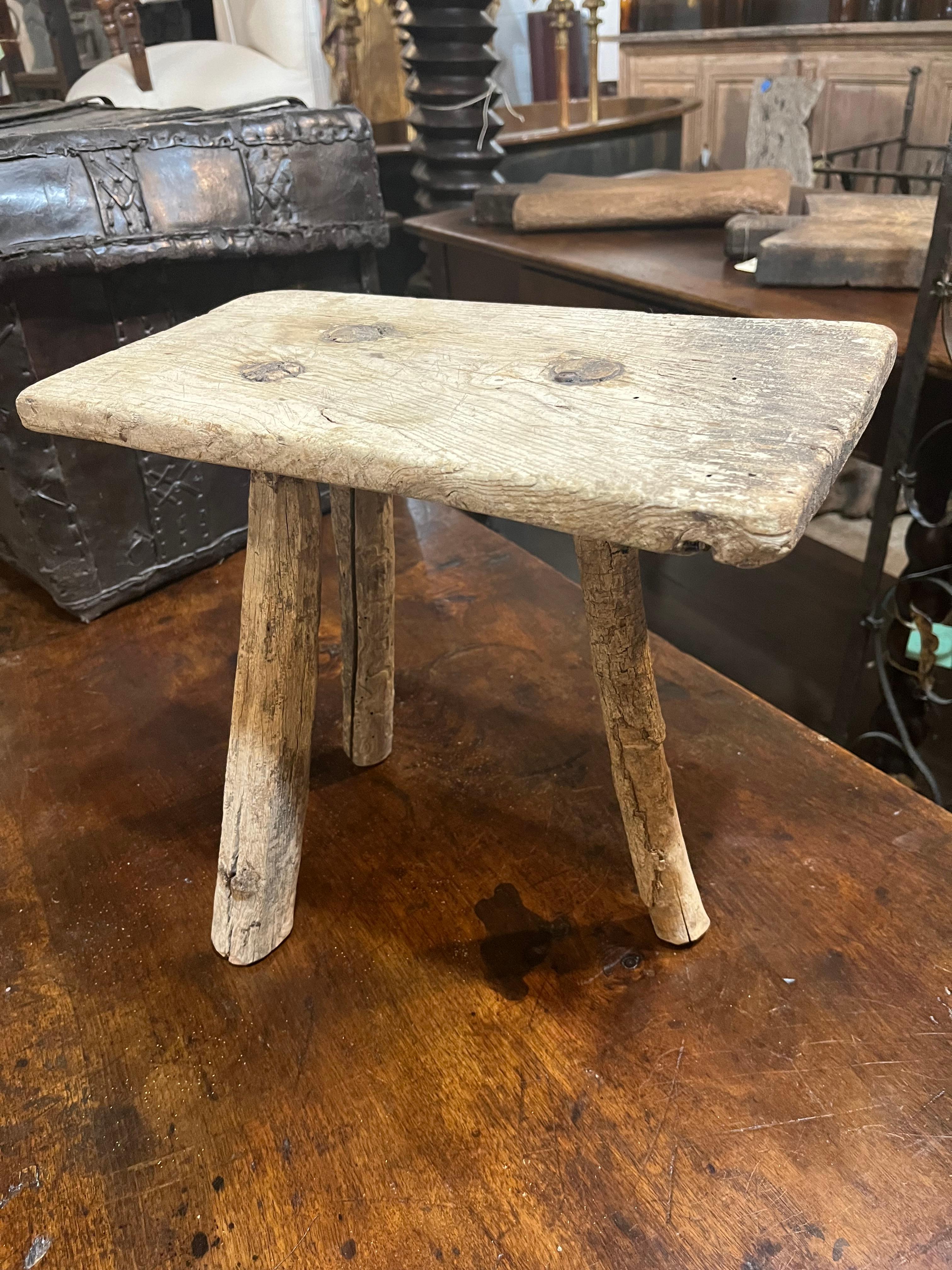 A very charming 19th century rustic Milking Stool from Spain in beautifully patina'd pine.  A wonderful accent piece.
