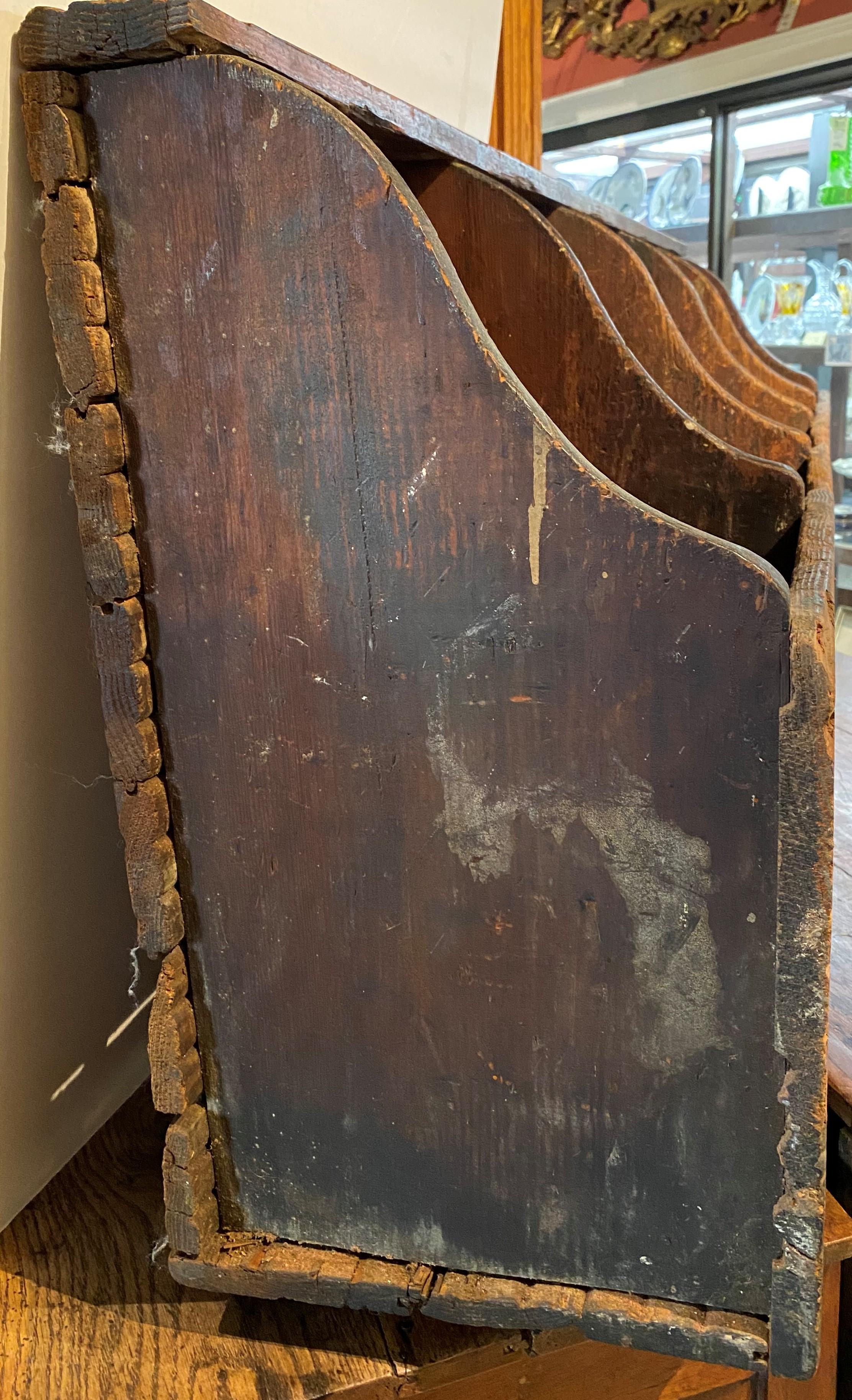 A 19th century primitive, orange and black painted grain bin with divided compartments. A great conversation and statement piece that could even be used as a woodbox for kindling, to store shoes in a mudroom, as a divider for recycling, and even