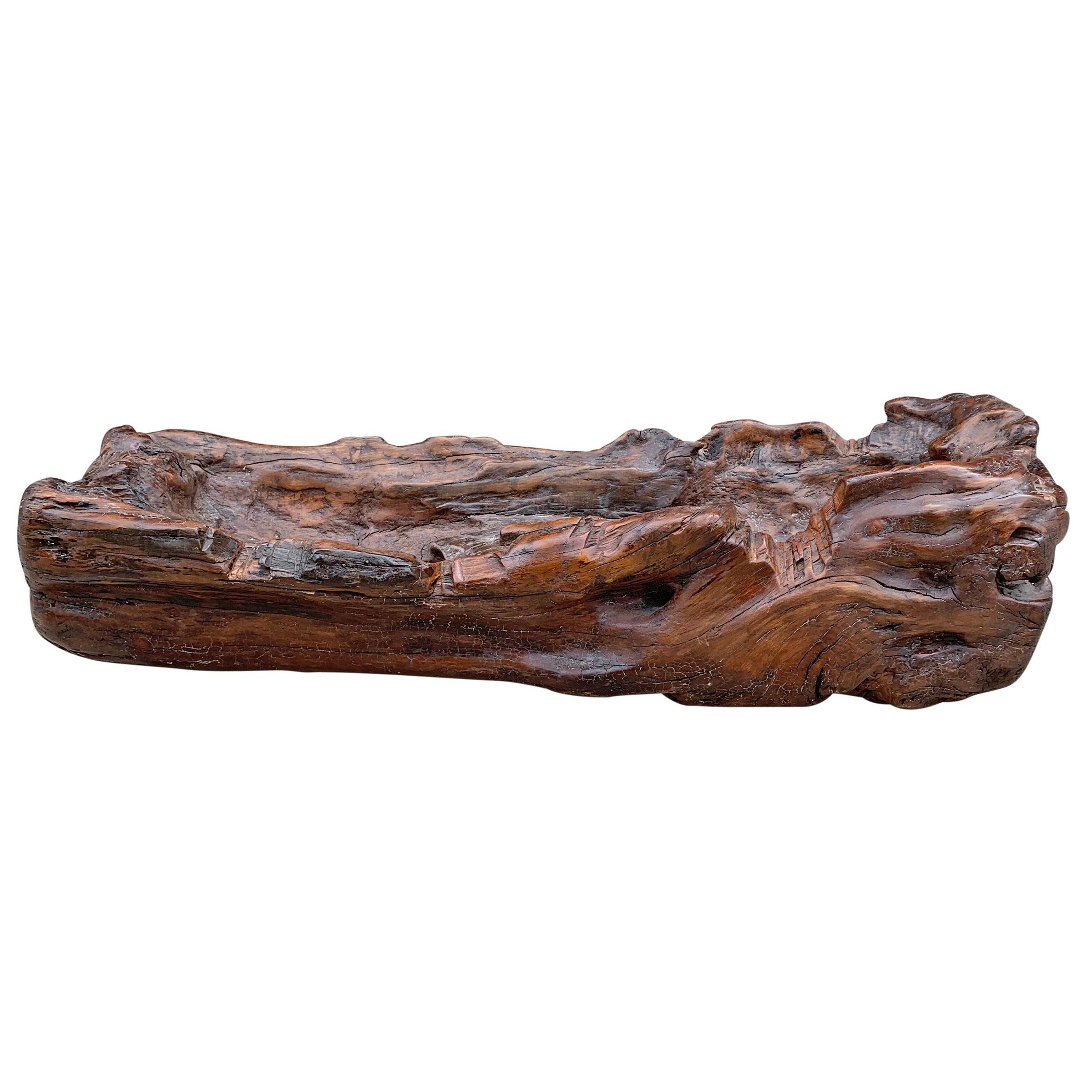 A beautiful 19th century Primitive wood trough used to feed livestock, carved from a hollowed out log, with a wonderful patina. Would make an excellent catchall, planter, or serving vessel at your next party.