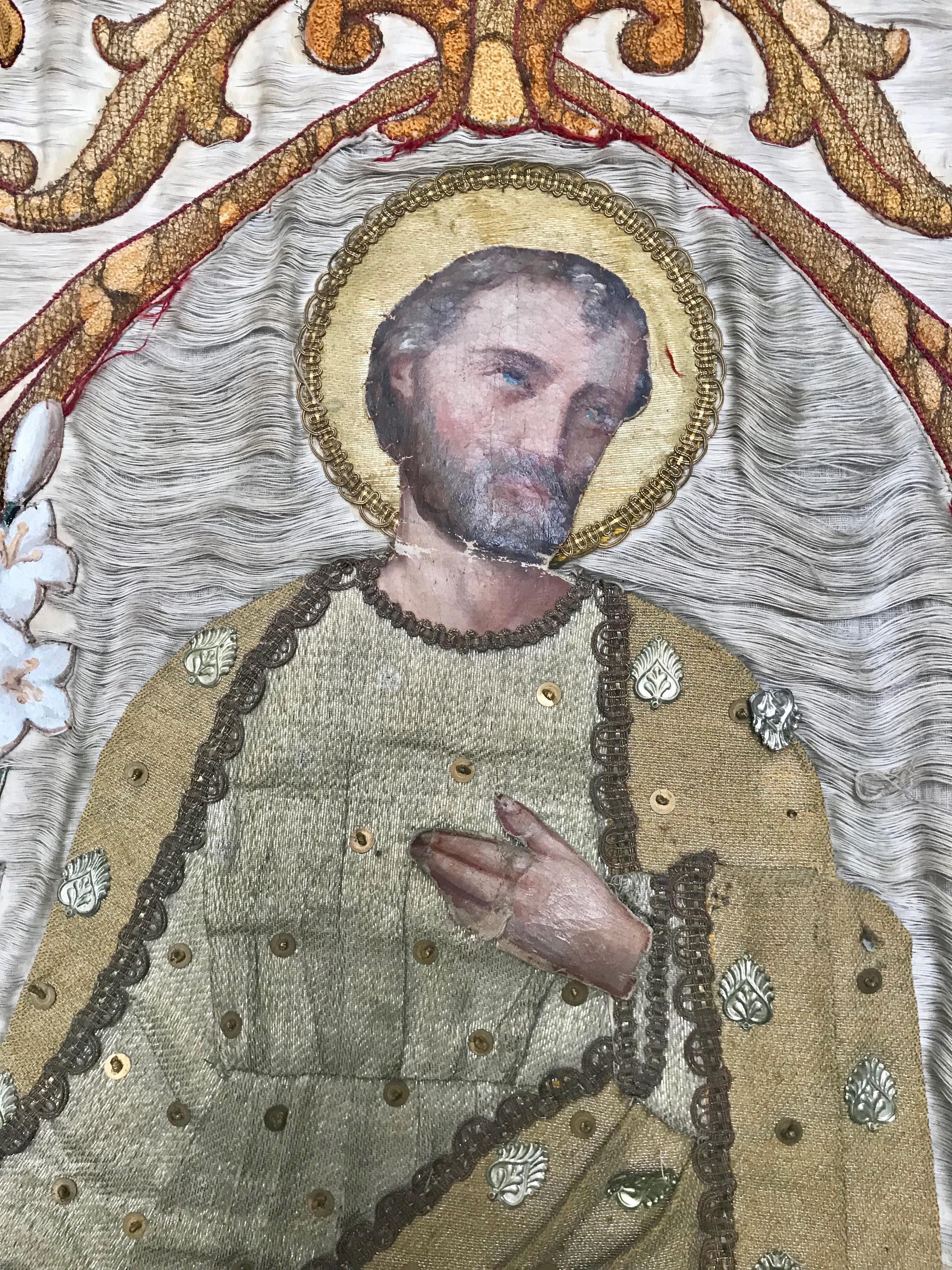 French processional banner created in a layered applique manner with details such as tiny silver pieces attached by hand.
The face, hands and feet are expertly hand painted on canvas and lend a most interesting dimension to the overall