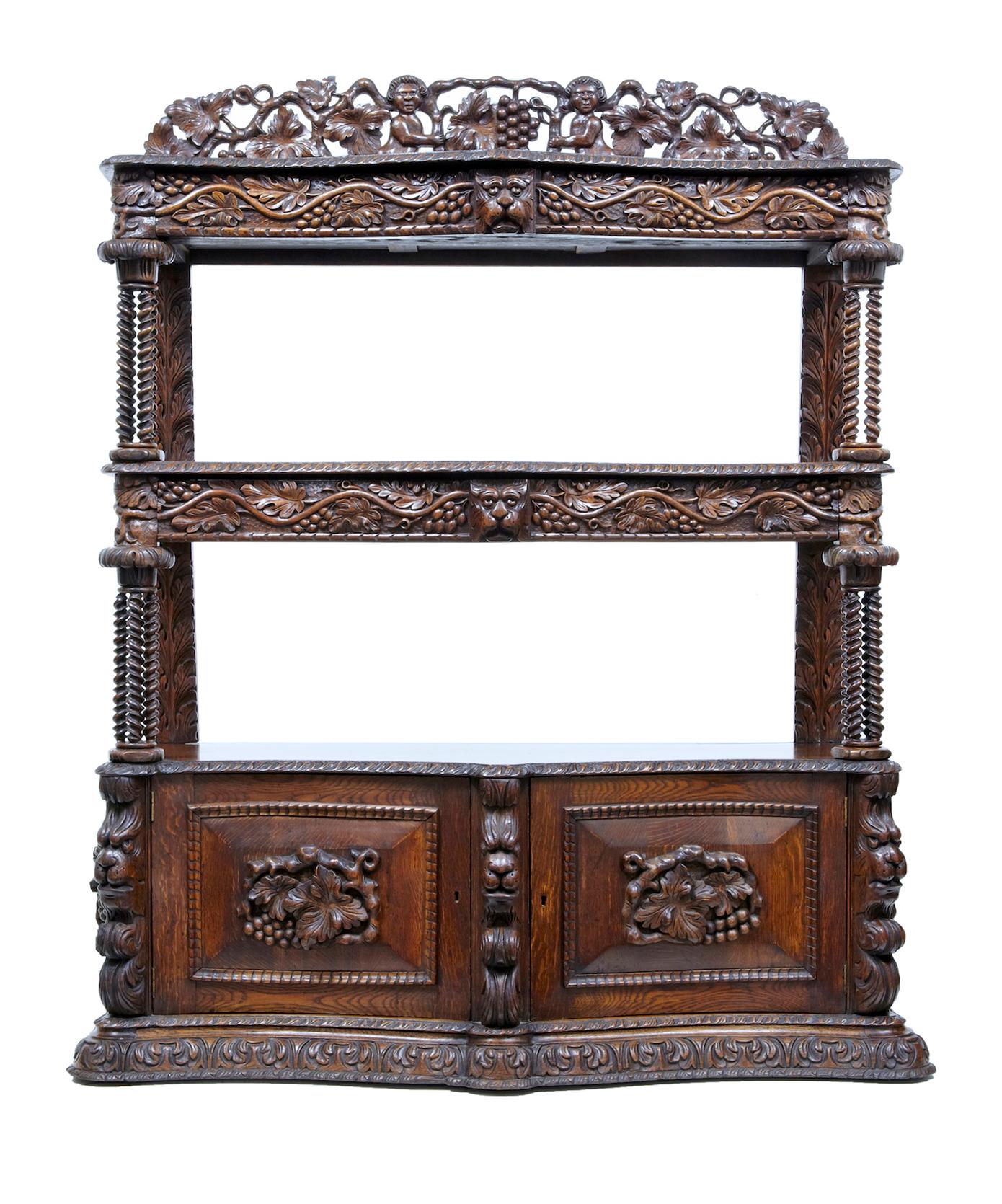 19th century profusely carved Victorian oak buffet, circa 1870.

Beautiful quality carved oak buffet, circa 1870. Comprising of 3 tiers, pierced carved gallery above and double door cupboard below. 1 drawer in the top 2 tiers, cupboard below opens