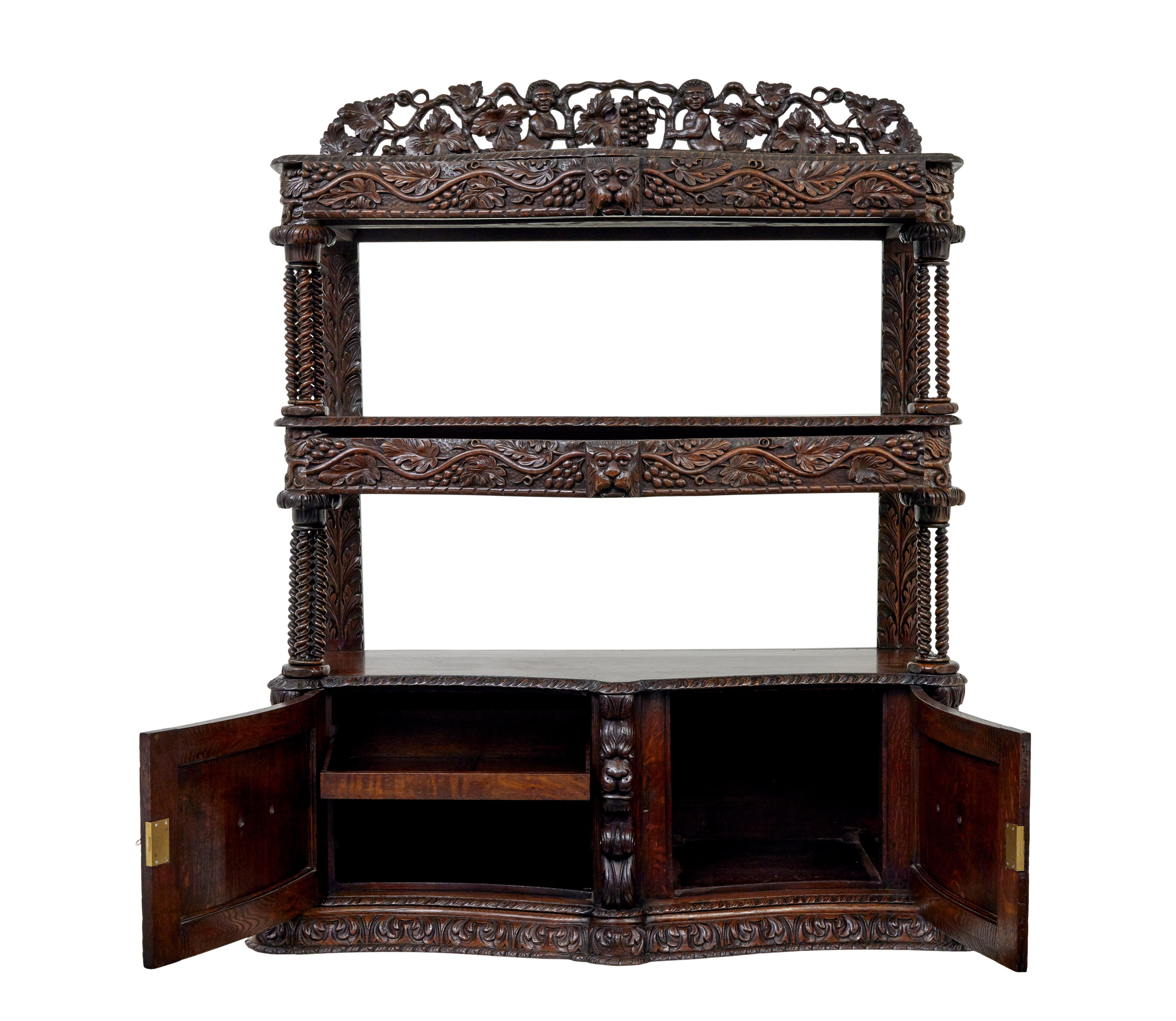 19th century profusely carved Victorian oak buffet circa 1870.

Beautiful quality carved oak buffet, circa 1870. Comprising of 3 tiers, pierced carved gallery above and double door cupboard below. 1 drawer in the top 2 tiers, cupboard below opens to