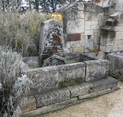 19th Century Provencal Style Stone Wall Fountain with Wrought Iron Water Spout