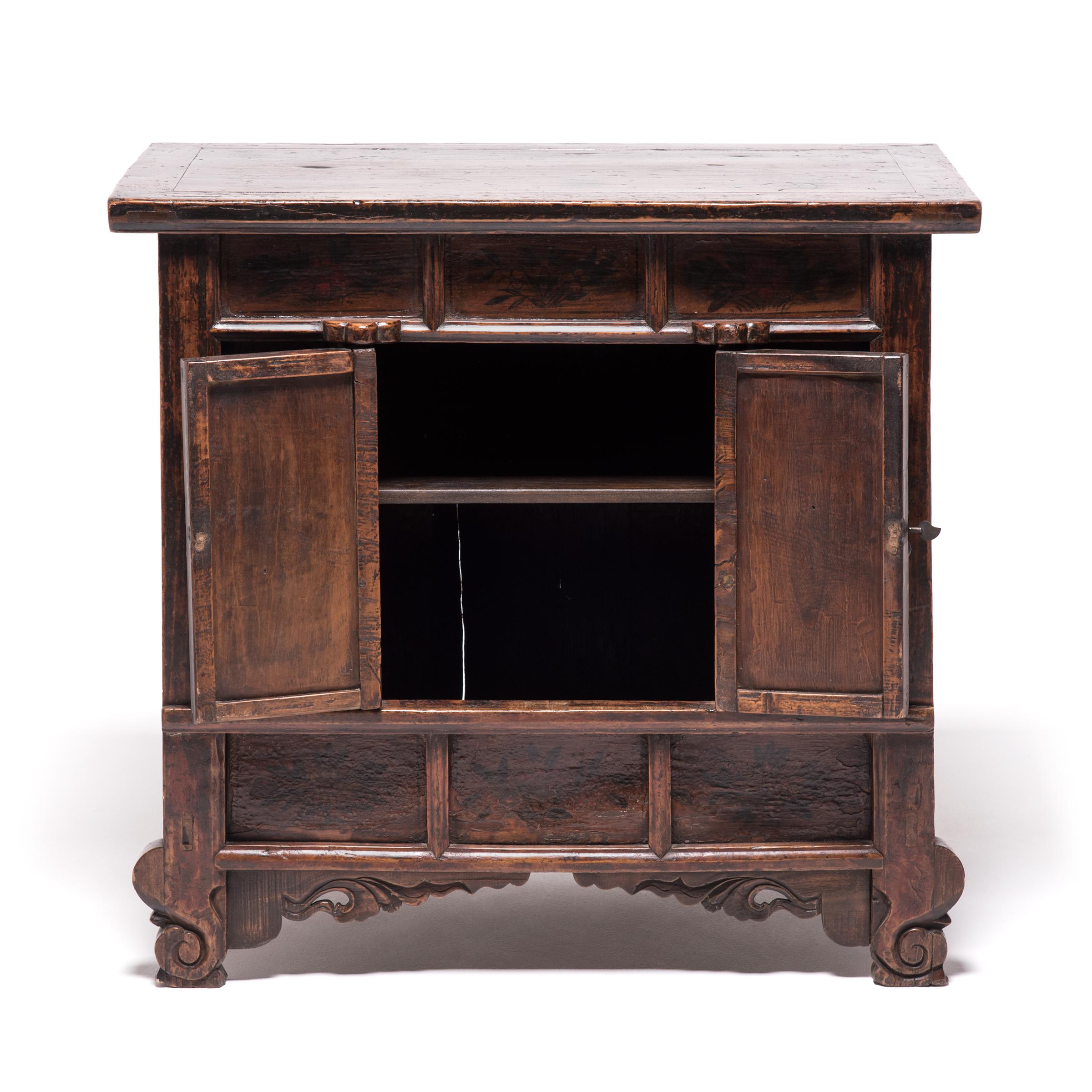 This Provincial two-door cabinet from China's northwest Gansu province is typical of the area's cabinet design during the late 19th century but the paneled front and overall form references styles from the Song dynasty thousands of years earlier.