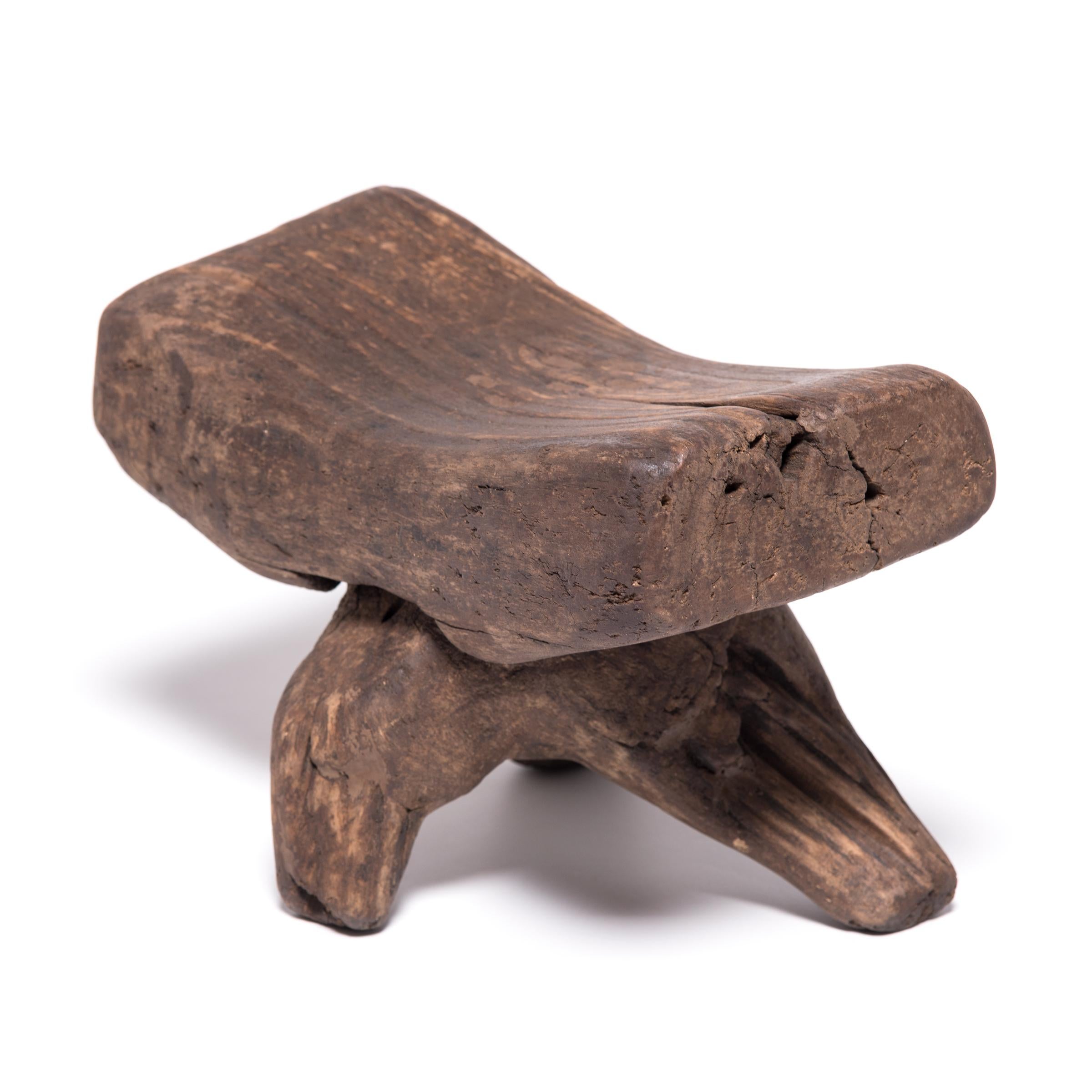 So as not to muss her intricate hairstyle, an upper-class woman once laid her head on this walnut headrest. Deviating from more finished varieties, this 19th century headrest has a sculptural, almost free form shape. Perhaps emulating the twisted