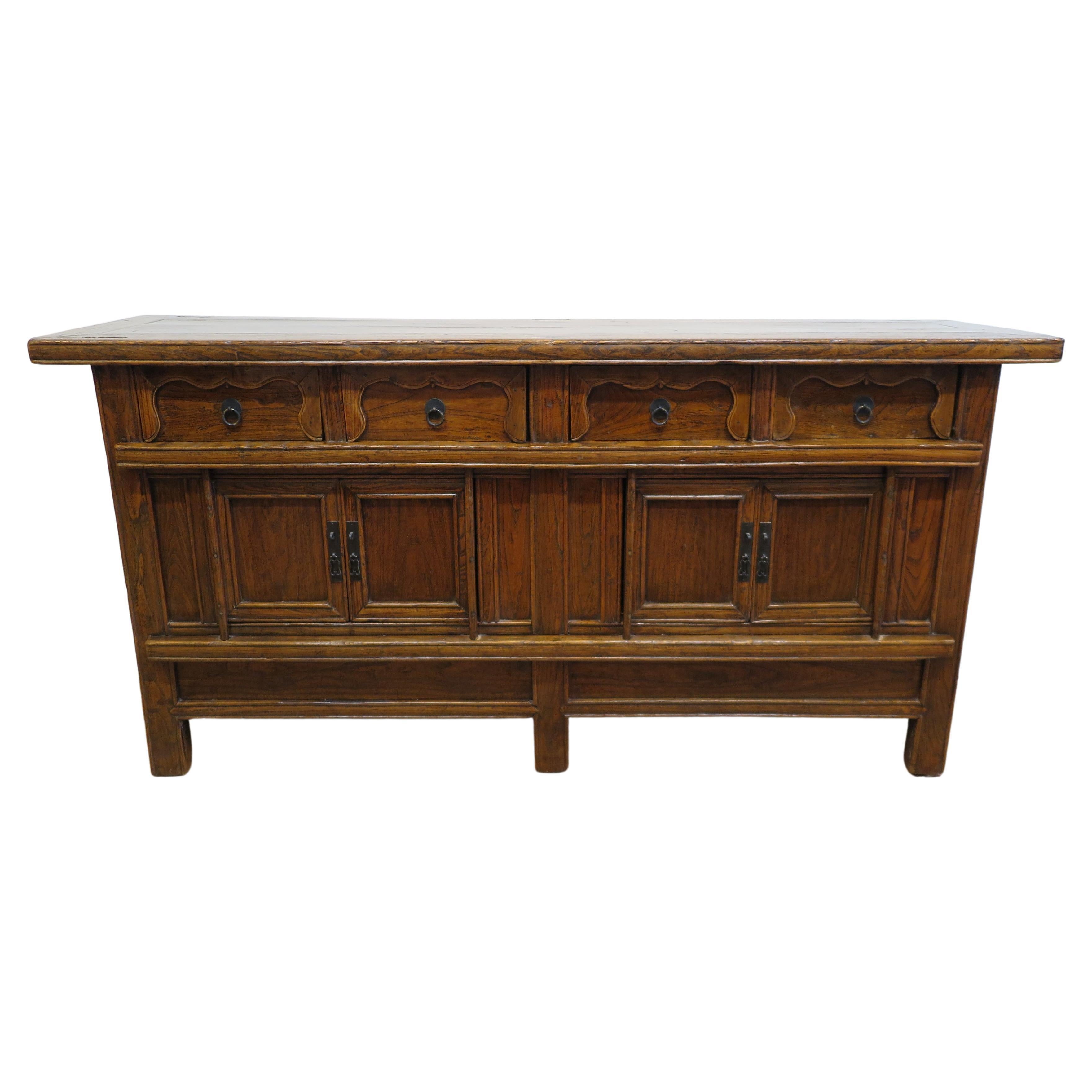 19th Century Provincial Sideboard.  Spectacular Country Sideboard, antique Chinese Sideboard from the countryside of Shanxi province.  The old growth Elm wood has a flowing grain prevalent with warm brown tones bringing the beauty and depth of the