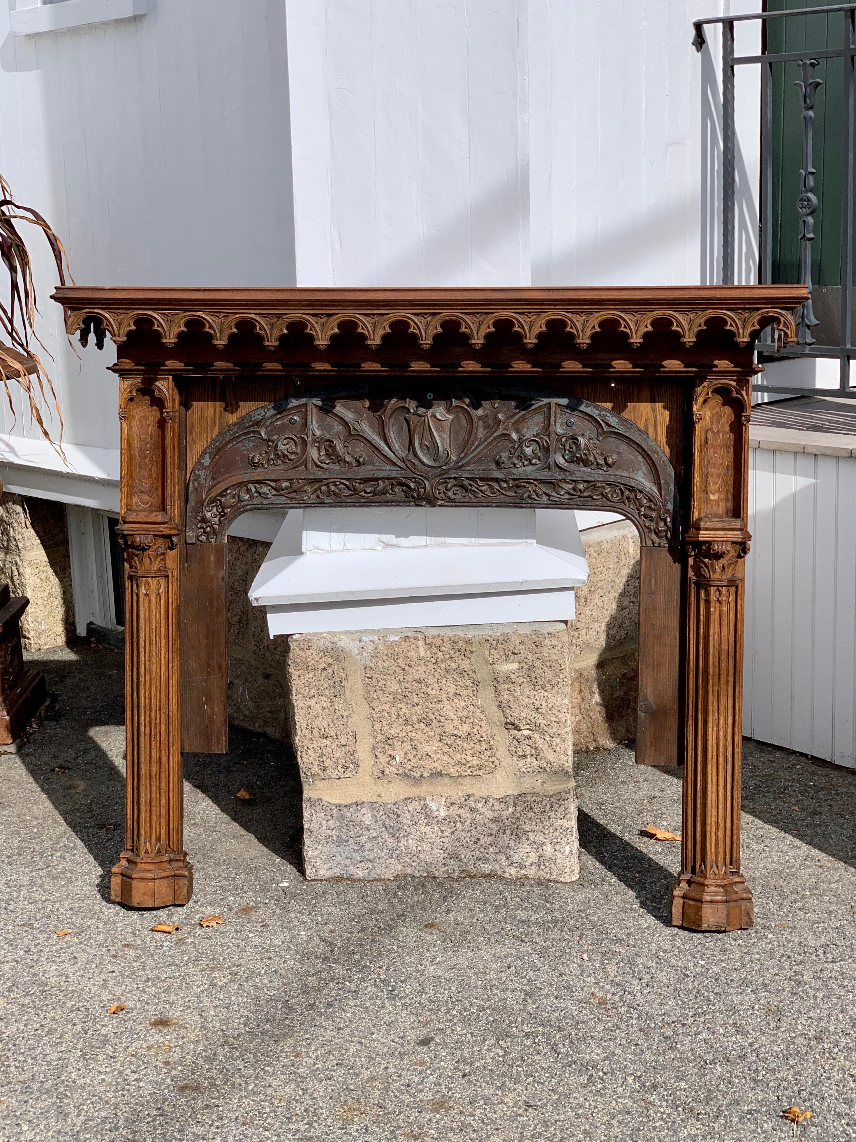 19th century Gothic fireplace in the Pugin style

Carved Gothic tracery in mantel frieze. Nicely carved with niches and Gothic columns. Inset iron Gothic arch under frieze. Wonderful usable size.

Measurements: Outside: 59