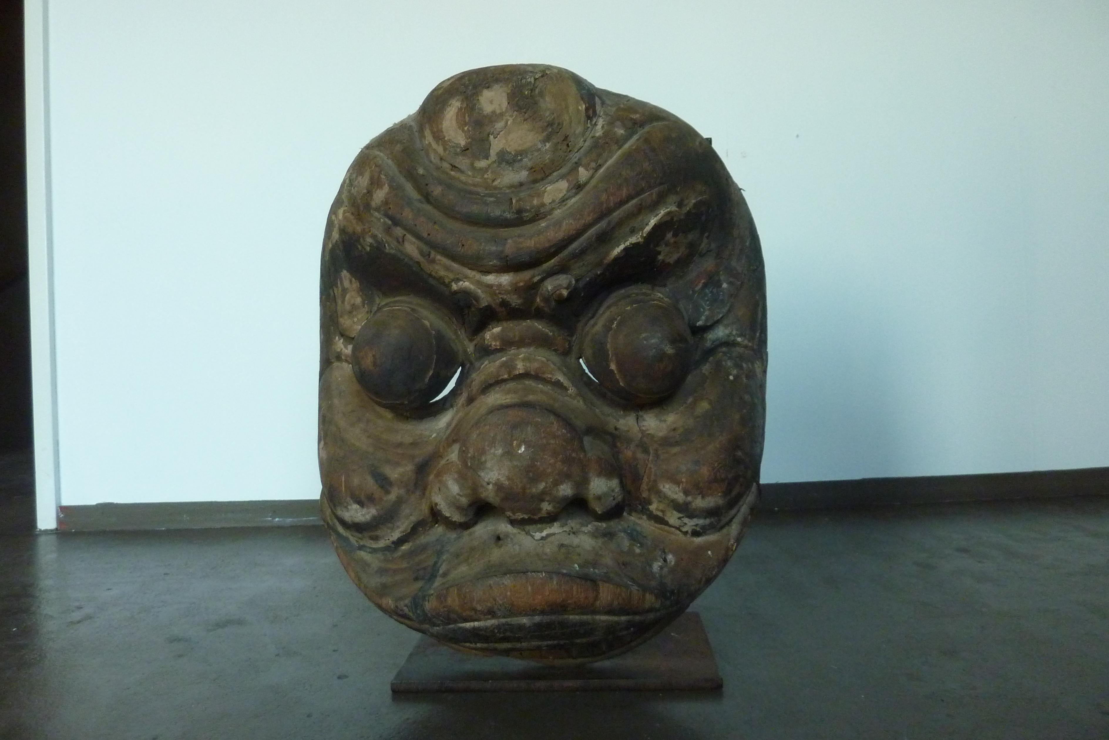 A 19th century Qing dynasty elmwood hand carved Mask from the Shangxi Provence mounted on custom iron stand.
Mask with a beautiful expression complete with lower jaw (often missing).