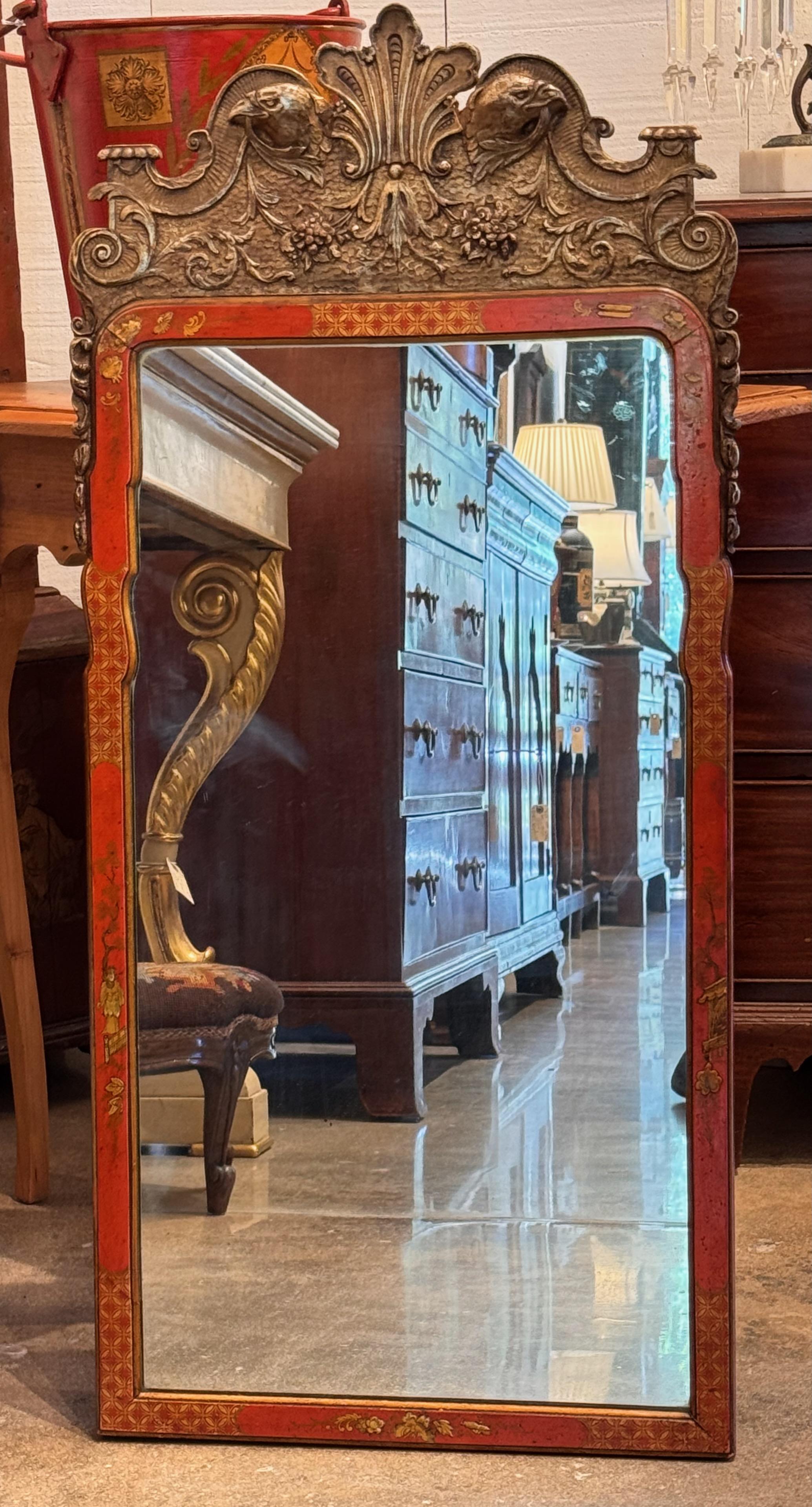 This mirror is beautifully decorated in the Chinoiserie style. It also has touches of gold.