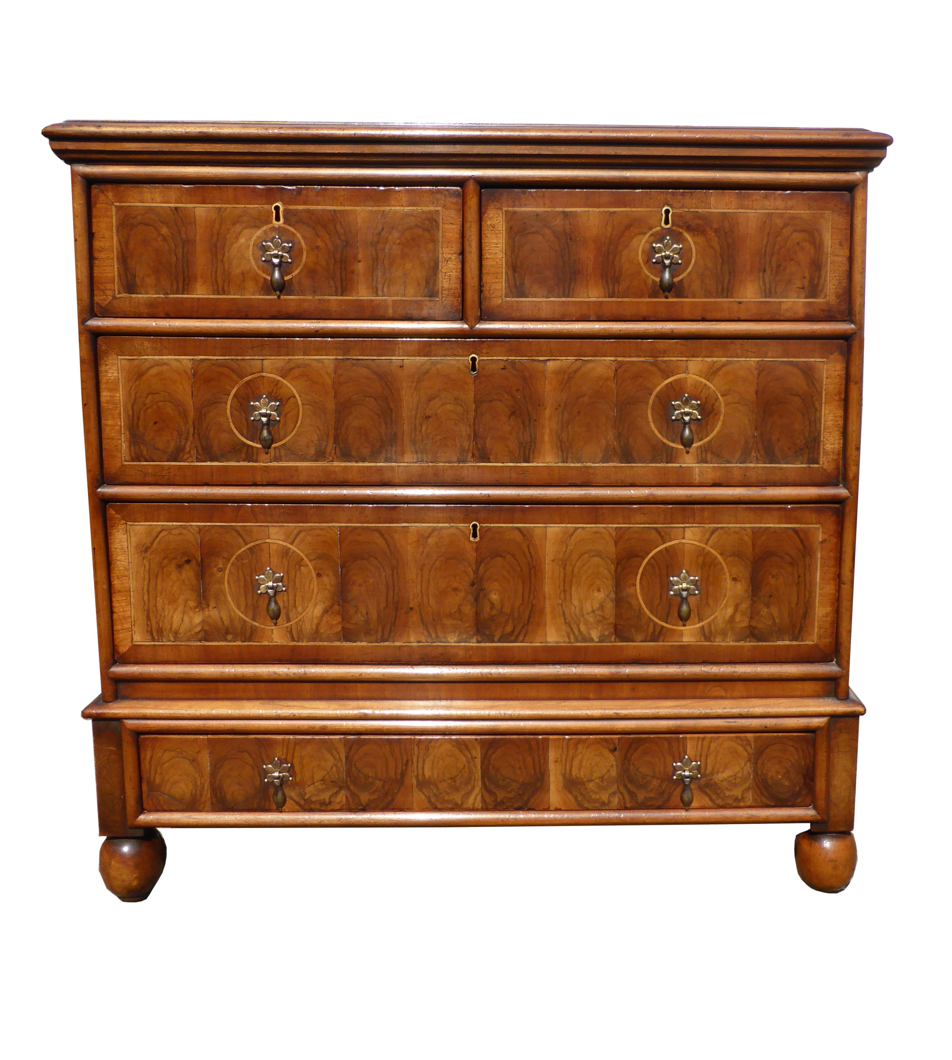 For sale is a Queen Anne style oyster shell veneered chest of drawers. The top of the chest has beautiful oyster shell veneer with circle white line inlays, below this are five-drawers, two short and three long. Each drawer has nice drop handles