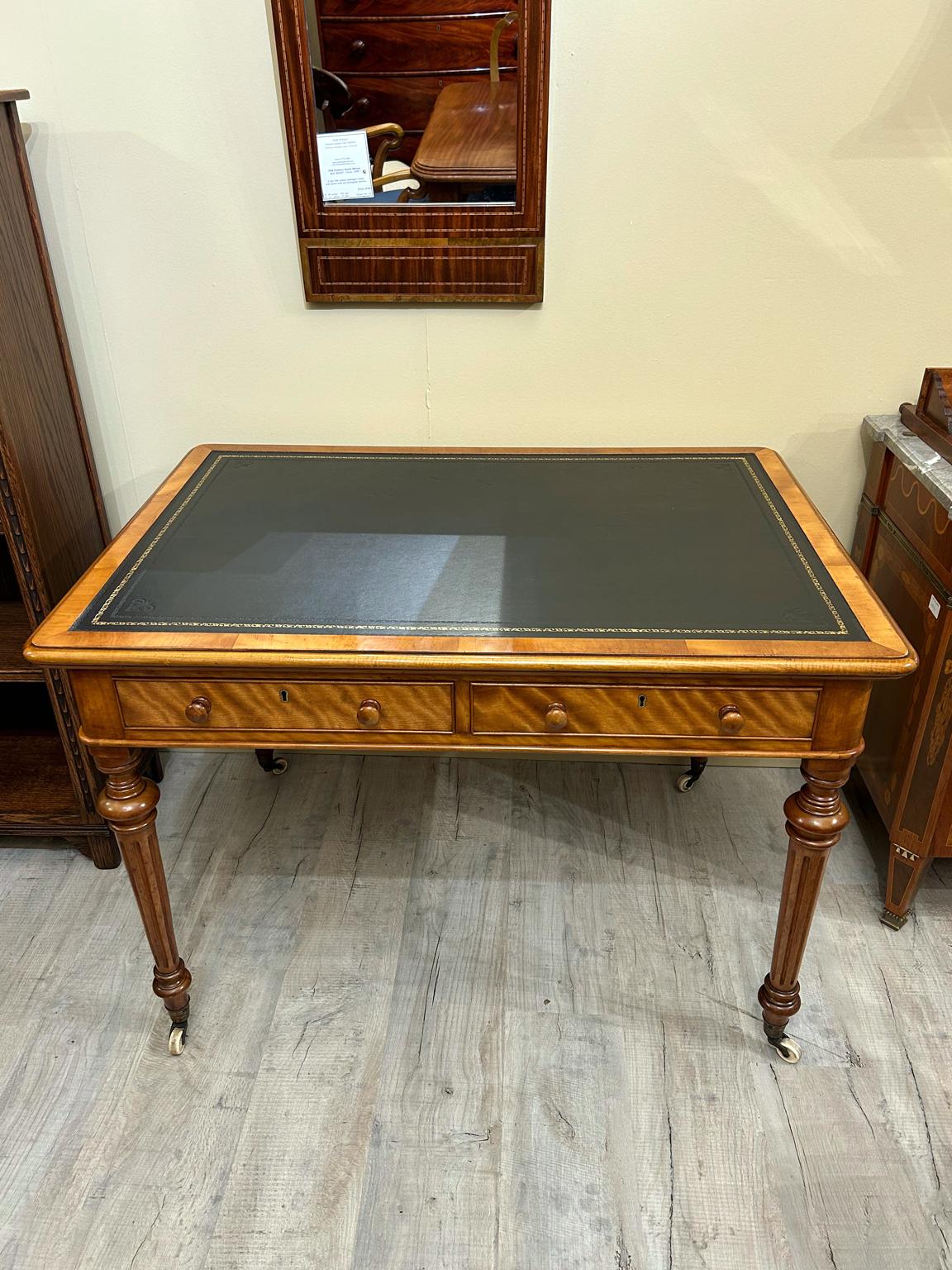 A high quality 19th Century Quilted Birch Writing Table with solid mahogany drawers with working keys. On turned reeded legs, with brass original castors to base.

Circa: 1860

Dimensions:
Height:   30 inches – 77 cms
Width:   43.5 inches – 110