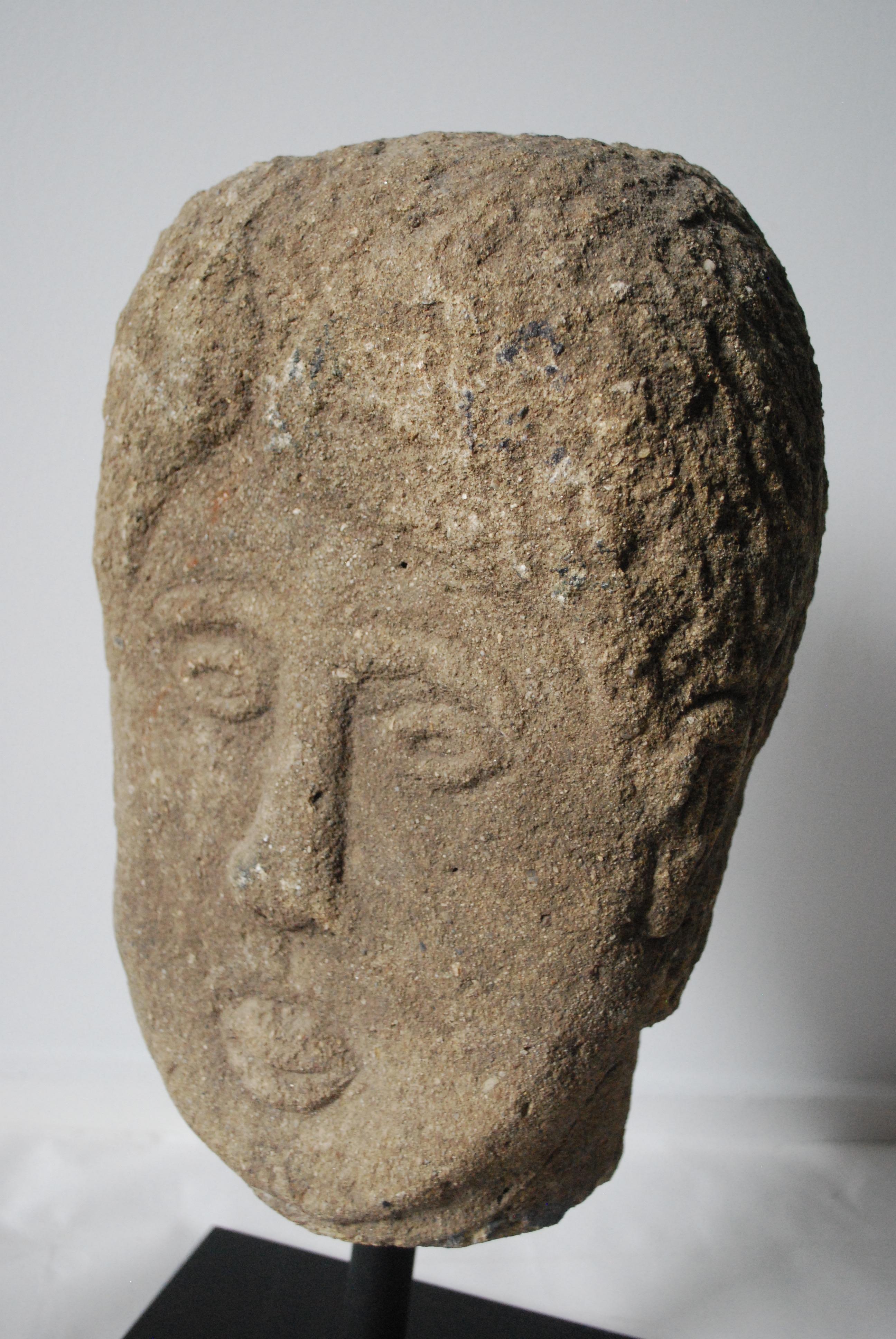 19th century quirky English stone head on stand.