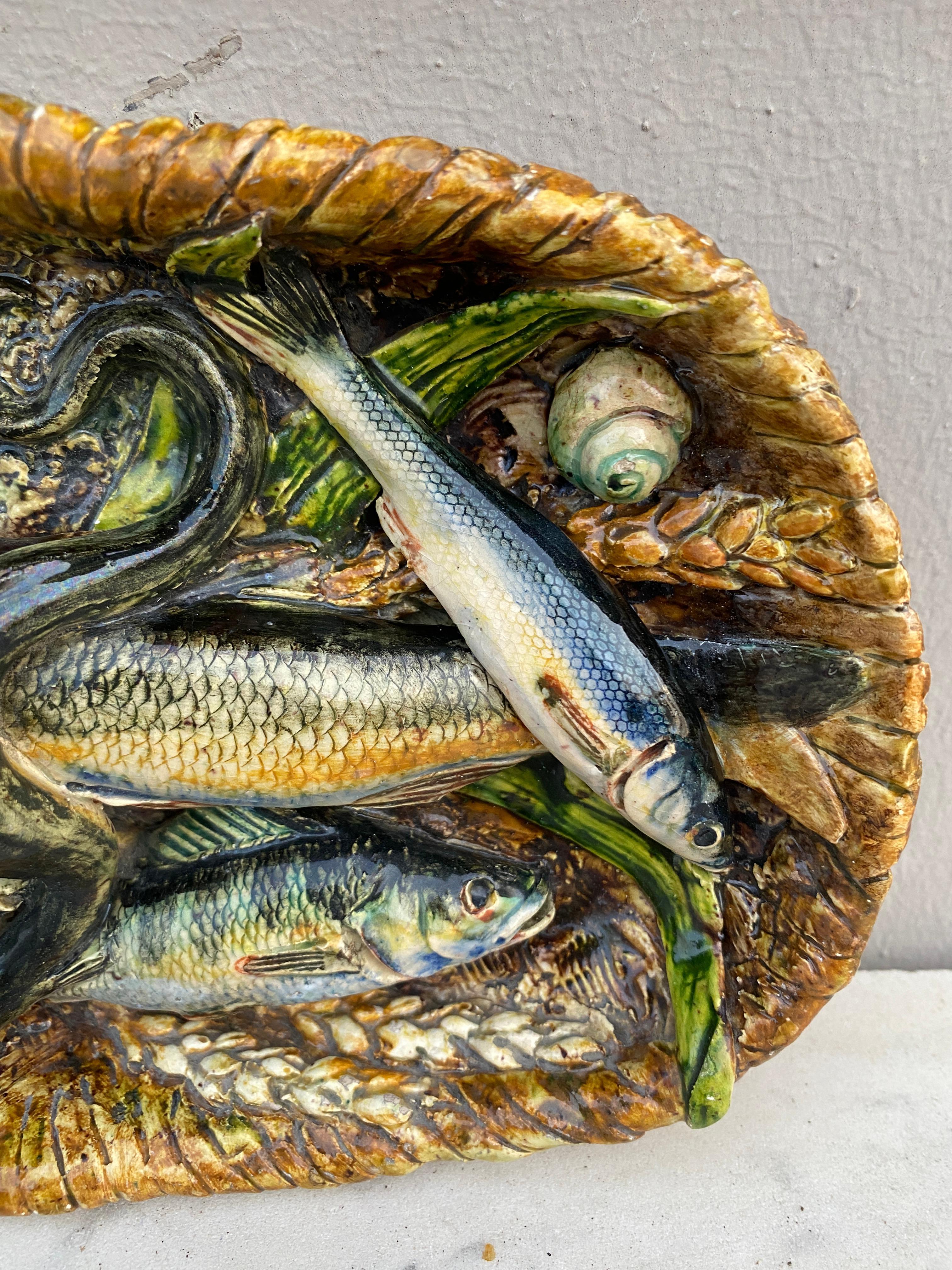 19th Century rare majolica palissy fish basket platter signed Leon Brard.
7 fishs, eel ,ears of wheat ,and shells.