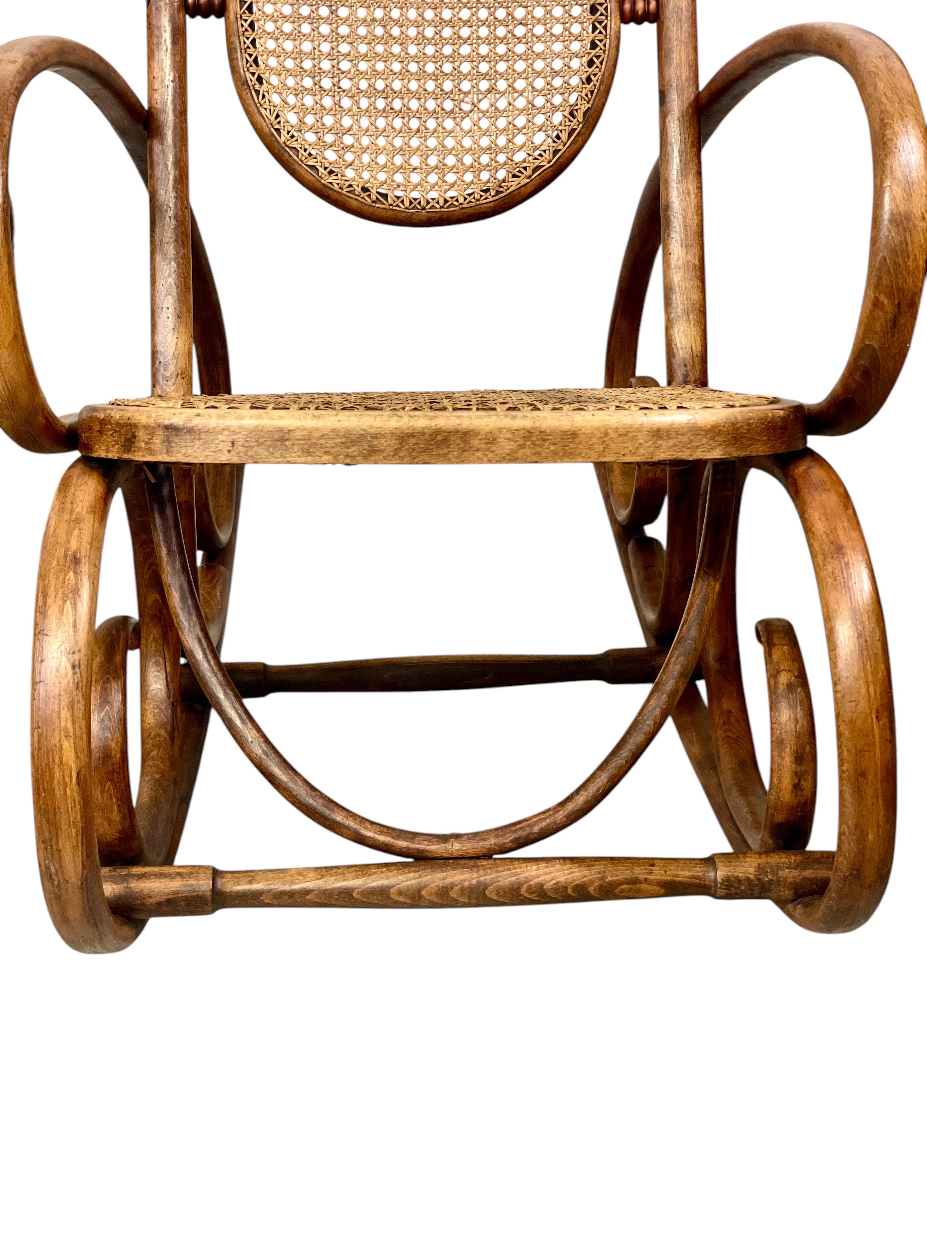 Caning 19th Century Rare Pair of Beechwood and Cane Rocking Chairs For Sale