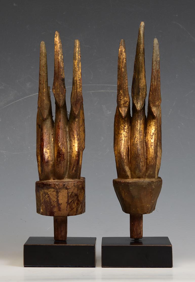 A pair of Thai wood carving with gilded gold.

Age: Thailand, Rattanakosin Period, 19th Century
Size including stand: Height 20.4 - 21.4 C.M. / Width 4.5 C.M.
Condition: Nice condition overall (some expected degradation due to their age).

100%