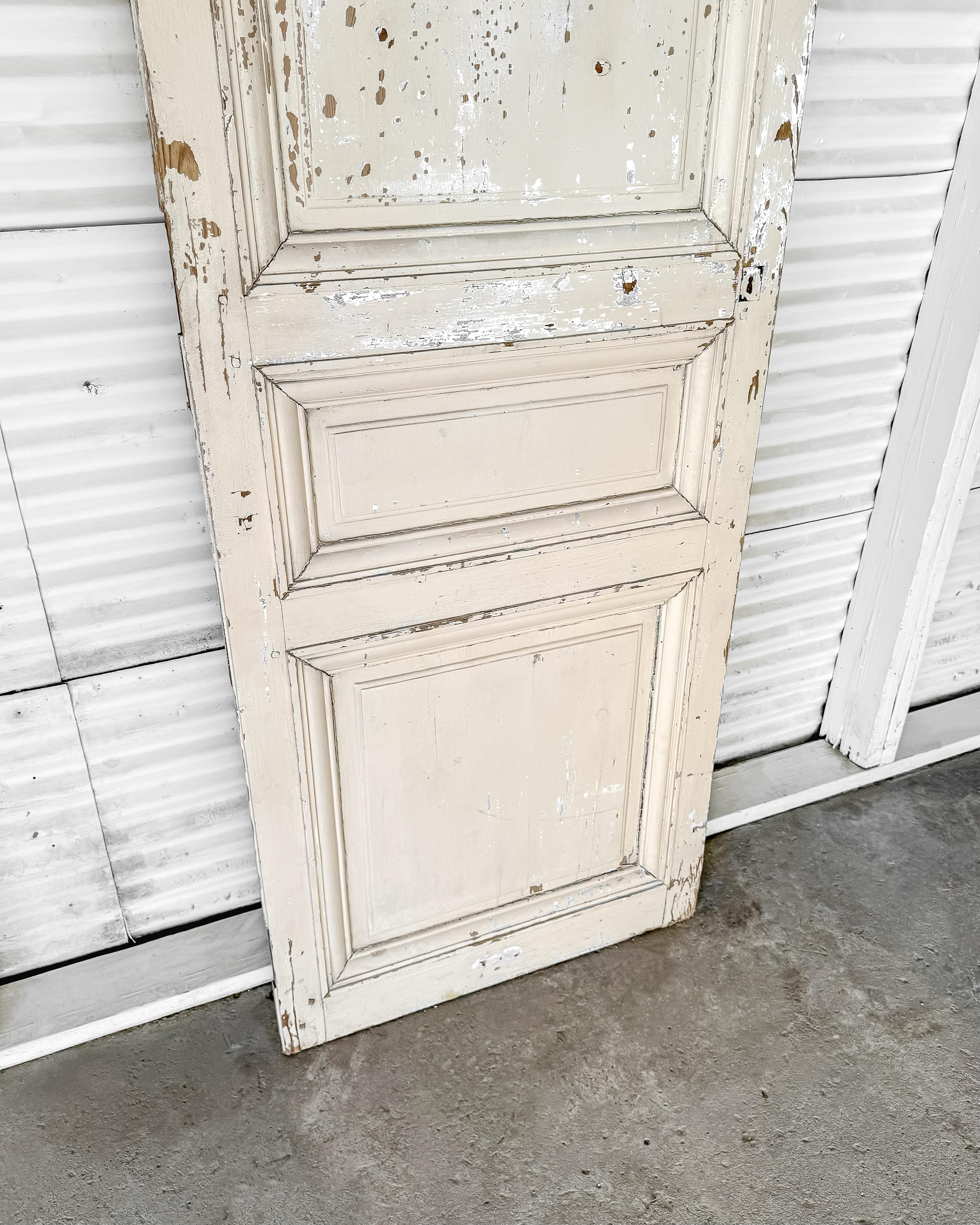 19th Century Reclaimed 3-Panel French Door with Worn Original Apricot Paint For Sale 1