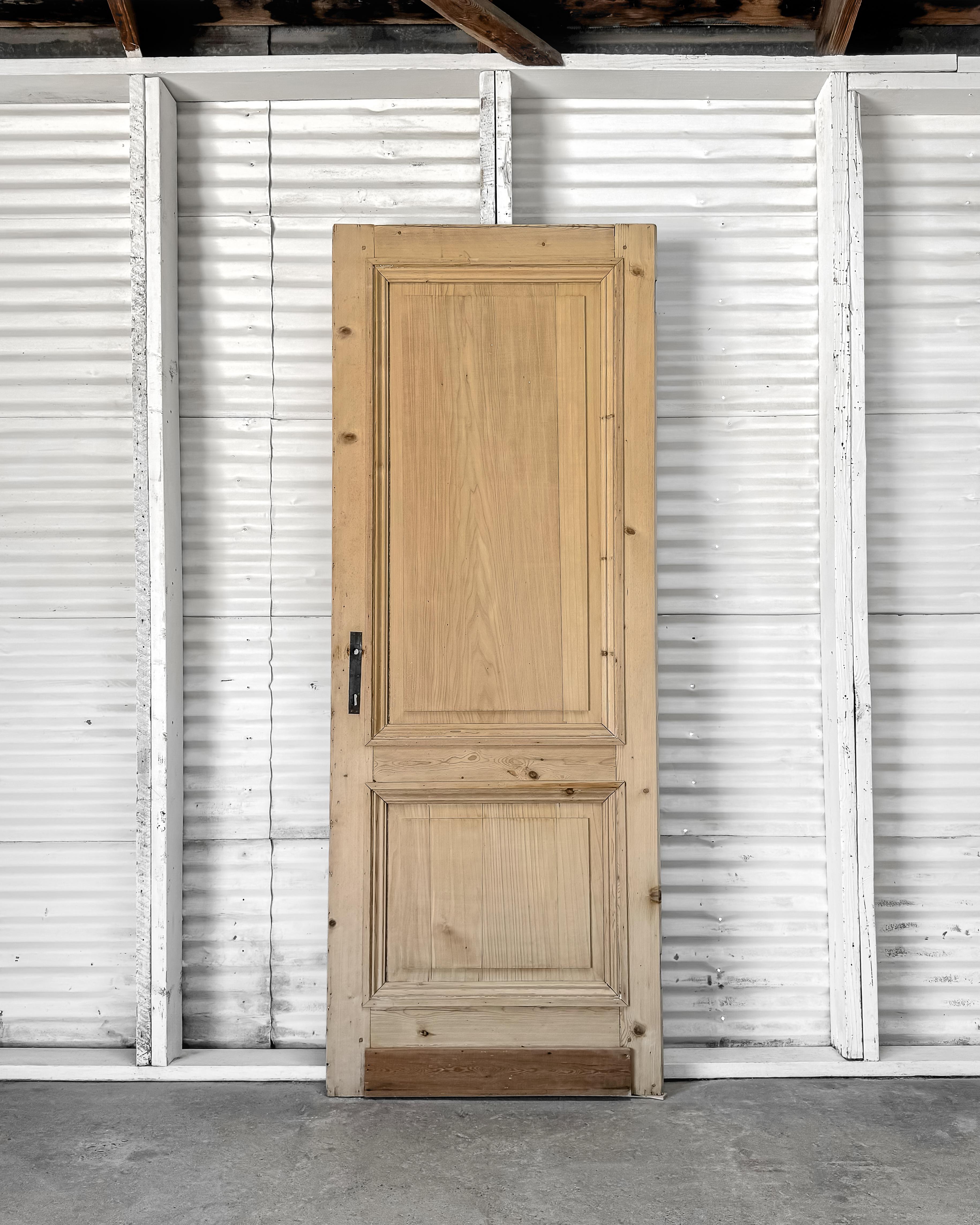 Install this 19th-century reclaimed door in your home to seamlessly blend history and modernity, creating a truly one-of-a-kind, authentic space. Salvaged from a house in Belgium, this beautiful piece boasts grooved beveled trim detailing,