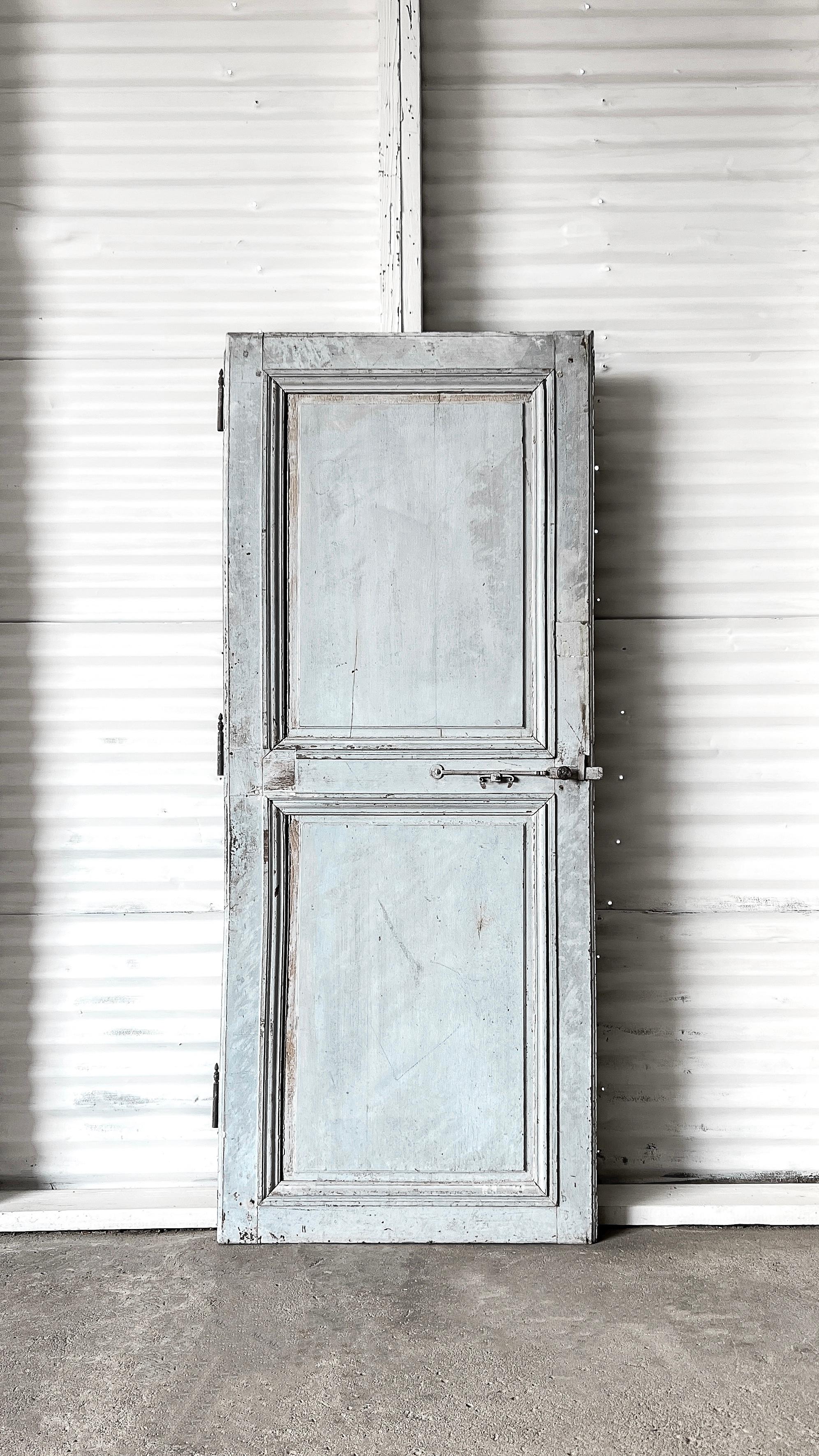 A beautiful reclaimed 19th-century 2-panel French door that would make a lovely pantry or linen door. The original “French blue” paint, raised panels, and double layers of grooved trim add an unrivaled character that can’t be replicated with modern