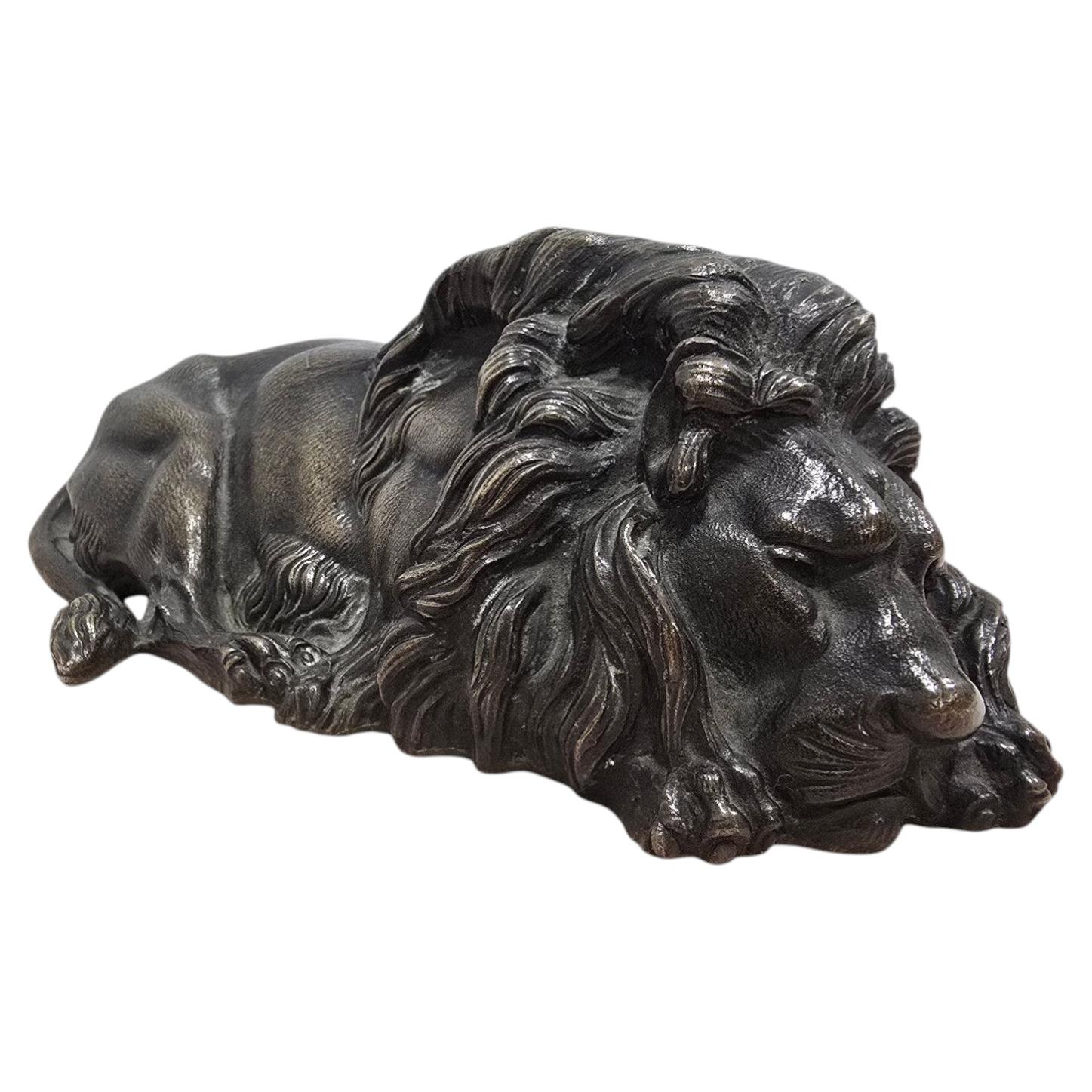 19th Century Reclining Bronze Lion Sculpture For Sale