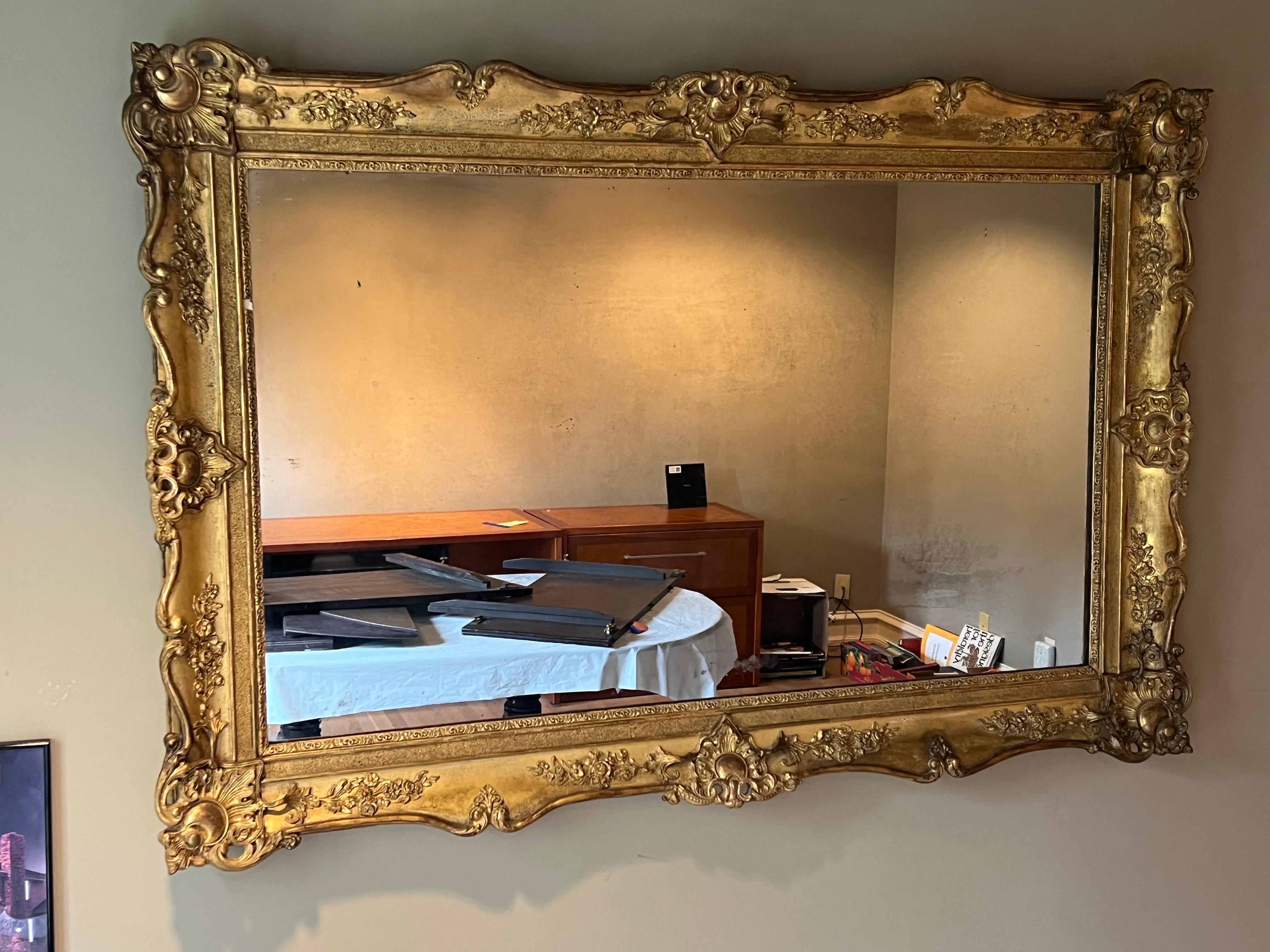 Alluring French Napoleon III giltwood mirror with lovely carved frame and trim. Having wonderful aged gilt finish, of desirable size and proportion, and with clean lines.