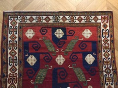 19th Century Red Blue Green White in Wool Kazak Pinwheel Crab Caucaso Rug, 1850s
