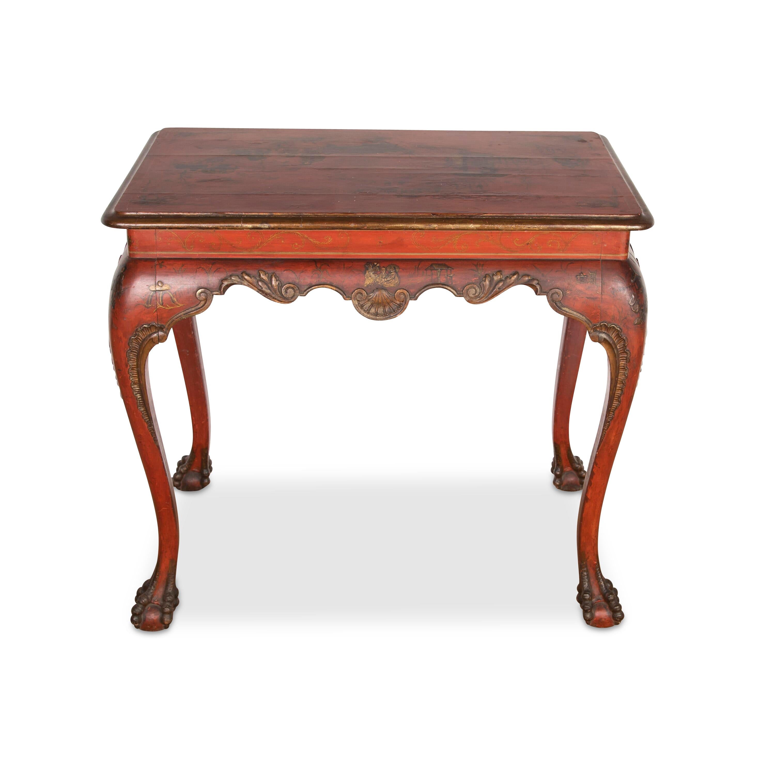 ﻿ A stylish early C19th Italian centre table, wonderfully decorated in red lacquer with gilt chinoiserie highlighted scene in the form of people, buildings and foliage. Raised on carved cabriole legs with shaped apron centred with shells and