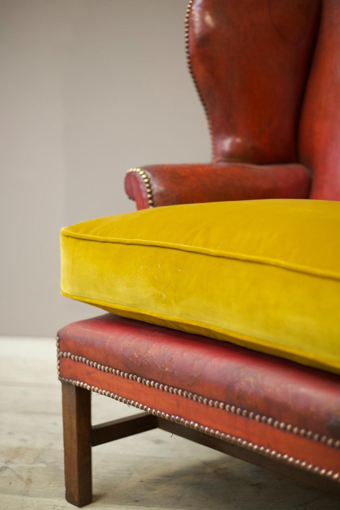 This a very impressive late Georgian early Victorian Red leather wingback armchair. The leather looks to be completely original and although the chair has had repairs to the legs they are all period repairs and absolutely solid. This chair is full