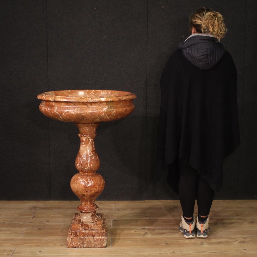 Antique Italian holy water font from the second half of the 19th century. Tub in veined red marble in seventeenth-century style composed of a circular basin with molded edge and multi-order turned baluster (see photo). Tub of great size and impact,