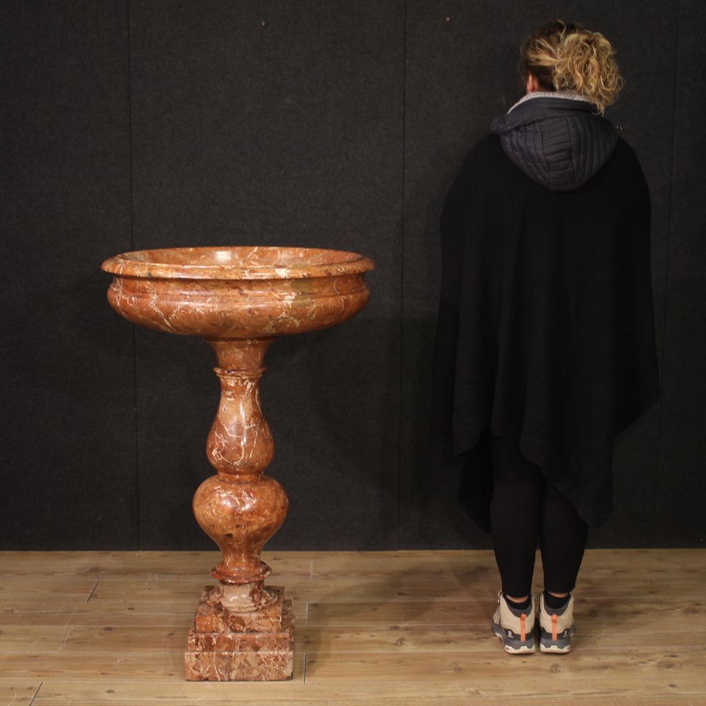 Antique Italian holy water font from the second half of the 19th century. Tub in veined red marble in seventeenth-century style composed of a circular basin with molded edge and multi-order turned baluster (see photo). Tub of great size and impact,